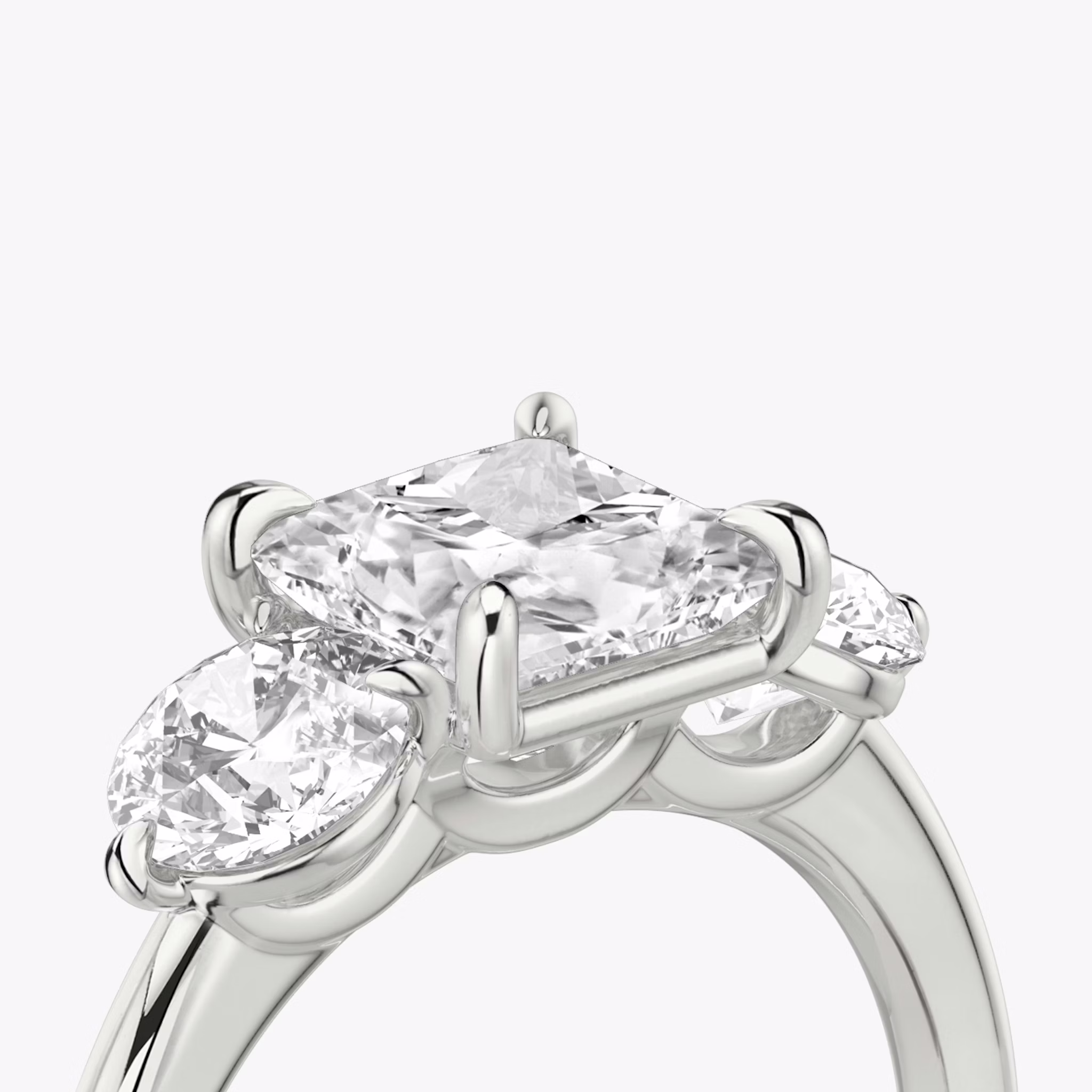 The Three Stone | Princess | 18k | White Gold | bandAccent: Plain | sideStoneCarat: 0.50ct | sideStoneShape: Round Brilliant | diamondOrientation: vertical | caratWeight: other