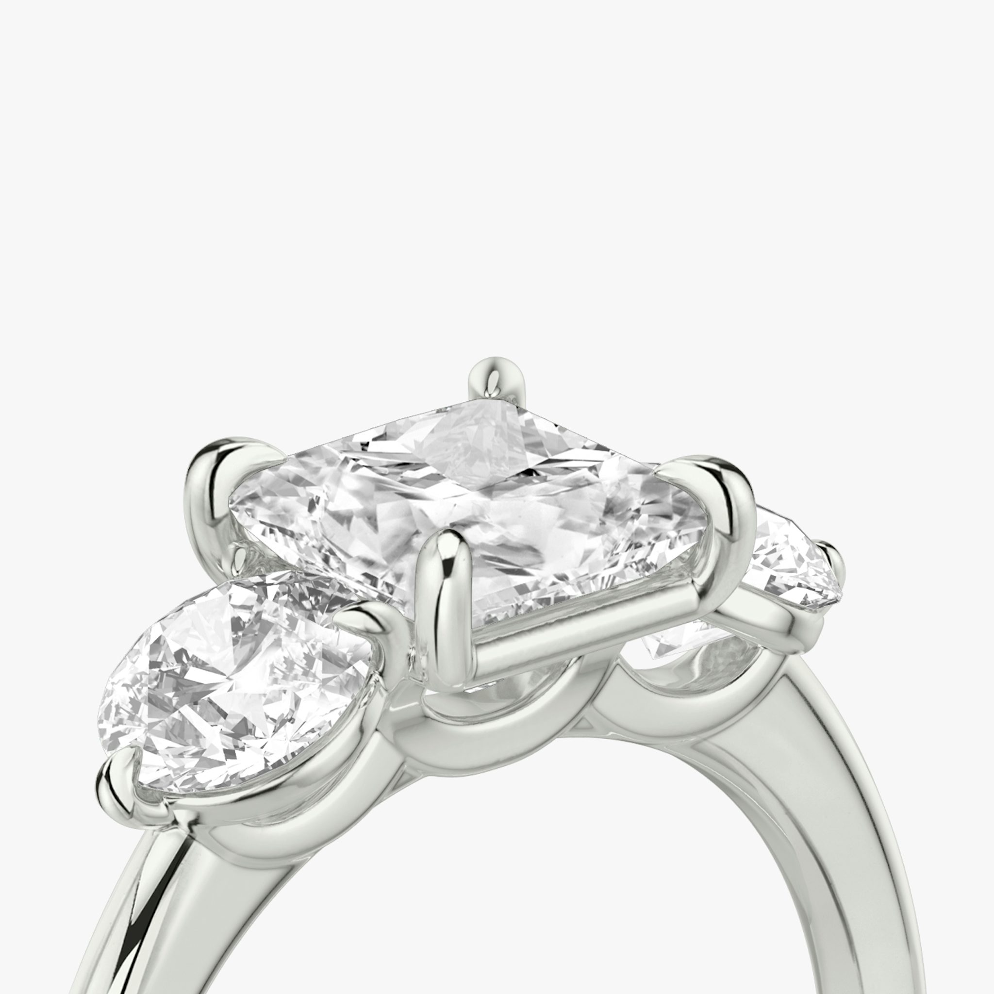 The Three Stone | Princess | 18k | White Gold | bandAccent: Plain | sideStoneCarat: 0.50ct | sideStoneShape: Round Brilliant | diamondOrientation: vertical | caratWeight: other