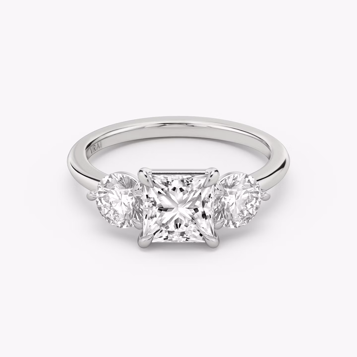 The Three Stone | Princess | 18k | White Gold | bandAccent: Plain | sideStoneCarat: 0.50ct | sideStoneShape: Round Brilliant | diamondOrientation: vertical | caratWeight: other