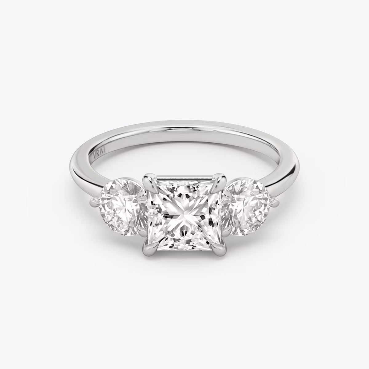 The Three Stone | Princess | Platinum | bandAccent: Plain | sideStoneCarat: 0.50ct | sideStoneShape: Round Brilliant | diamondOrientation: vertical | caratWeight: other