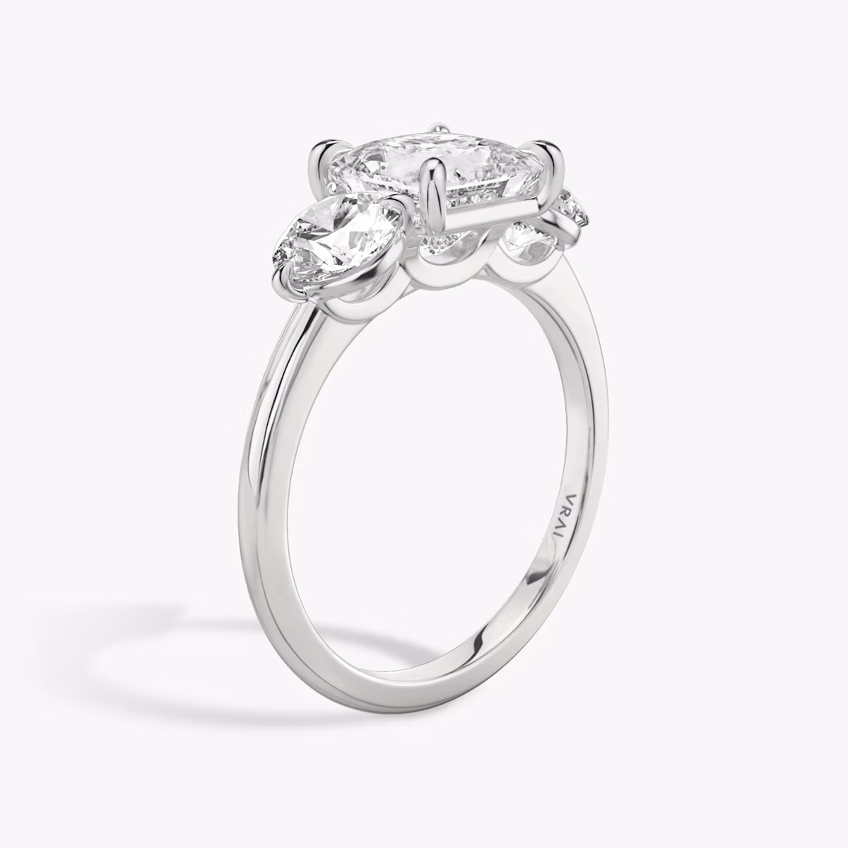 The Three Stone | Princess | Platinum | bandAccent: Plain | sideStoneCarat: 0.50ct | sideStoneShape: Round Brilliant | diamondOrientation: vertical | caratWeight: other