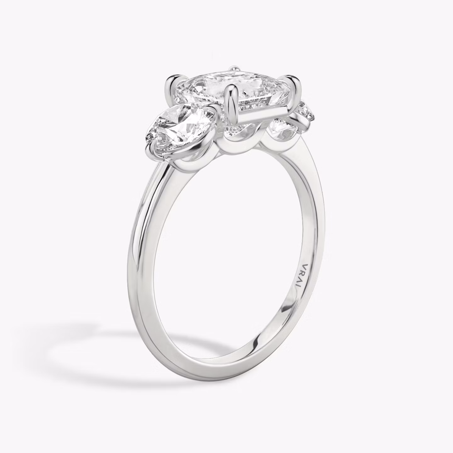 The Three Stone | Princess | Platinum | bandAccent: Plain | sideStoneCarat: 0.50ct | sideStoneShape: Round Brilliant | diamondOrientation: vertical | caratWeight: other