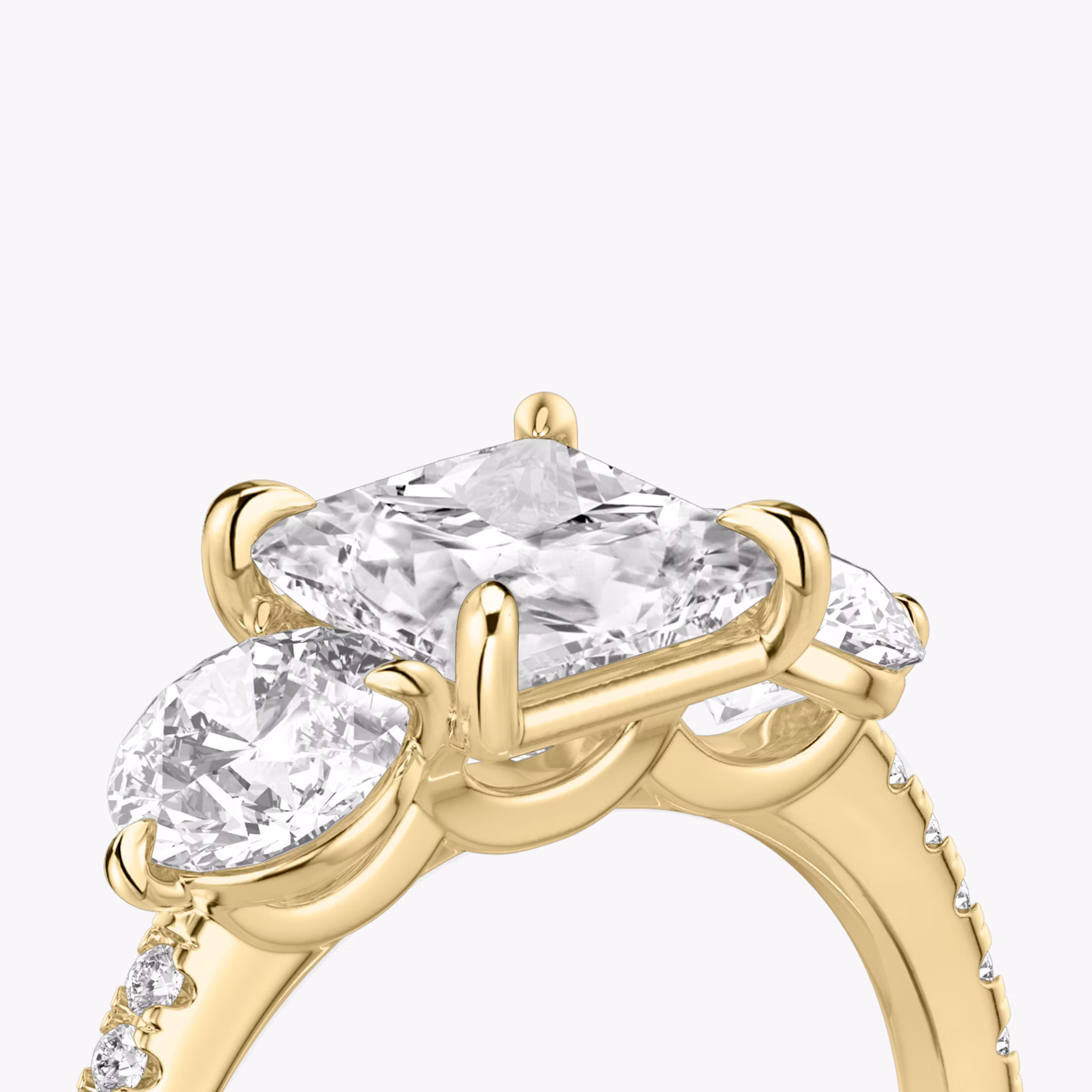 The Three Stone | Princess | 18k | Yellow Gold | bandAccent: Pavé | sideStoneCarat: 0.50ct | sideStoneShape: Round Brilliant | diamondOrientation: vertical | caratWeight: other