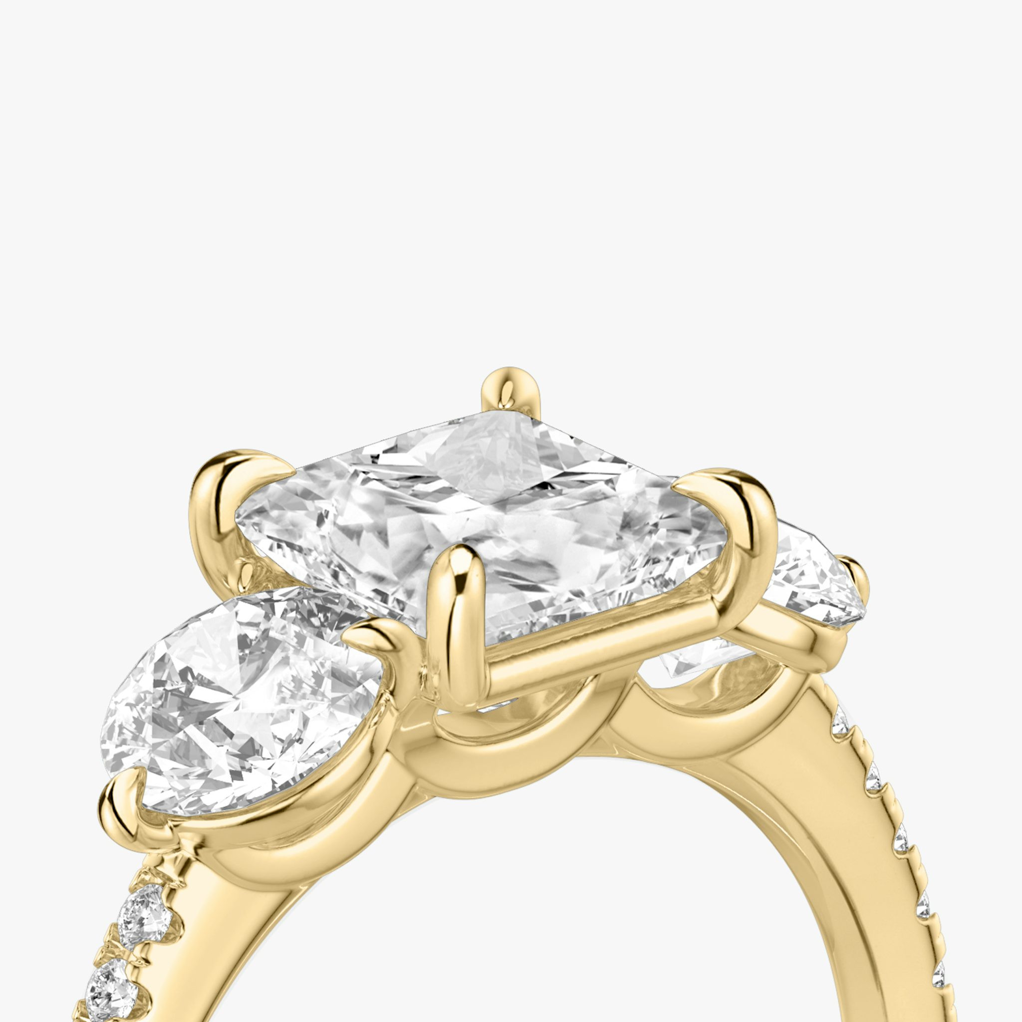The Three Stone | Princess | 18k | Yellow Gold | bandAccent: Pavé | sideStoneCarat: 0.50ct | sideStoneShape: Round Brilliant | diamondOrientation: vertical | caratWeight: other