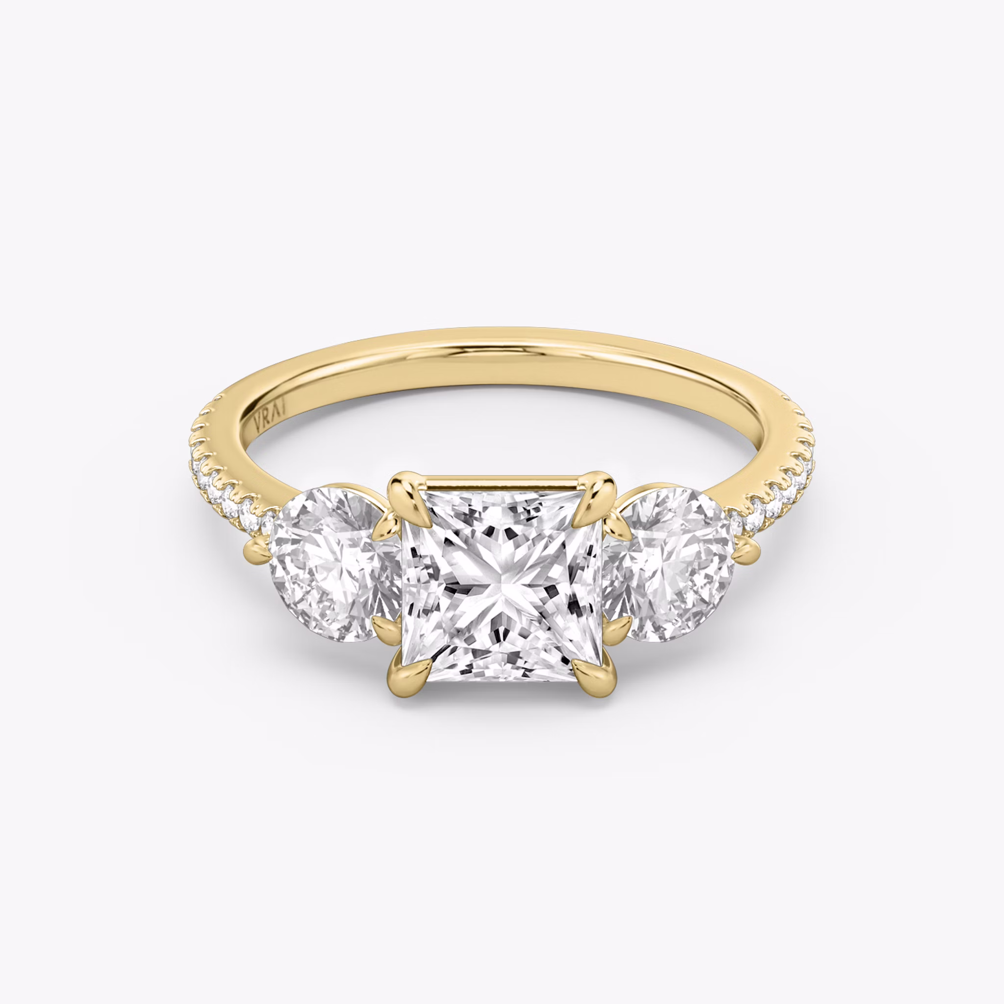 The Three Stone | Princess | 18k | Yellow Gold | bandAccent: Pavé | sideStoneCarat: 0.50ct | sideStoneShape: Round Brilliant | diamondOrientation: vertical | caratWeight: other