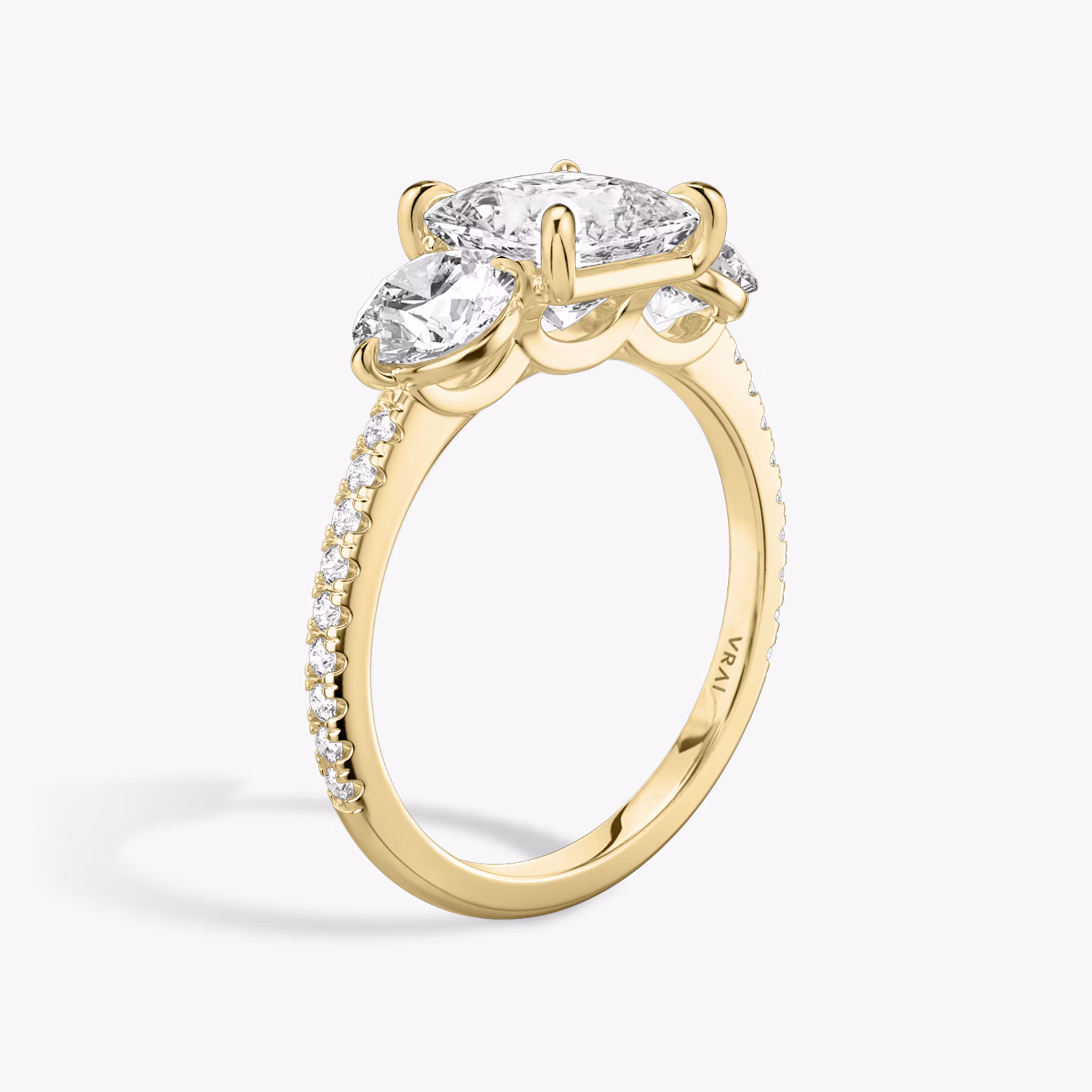 The Three Stone | Princess | 18k | Yellow Gold | bandAccent: Pavé | sideStoneCarat: 0.50ct | sideStoneShape: Round Brilliant | diamondOrientation: vertical | caratWeight: other