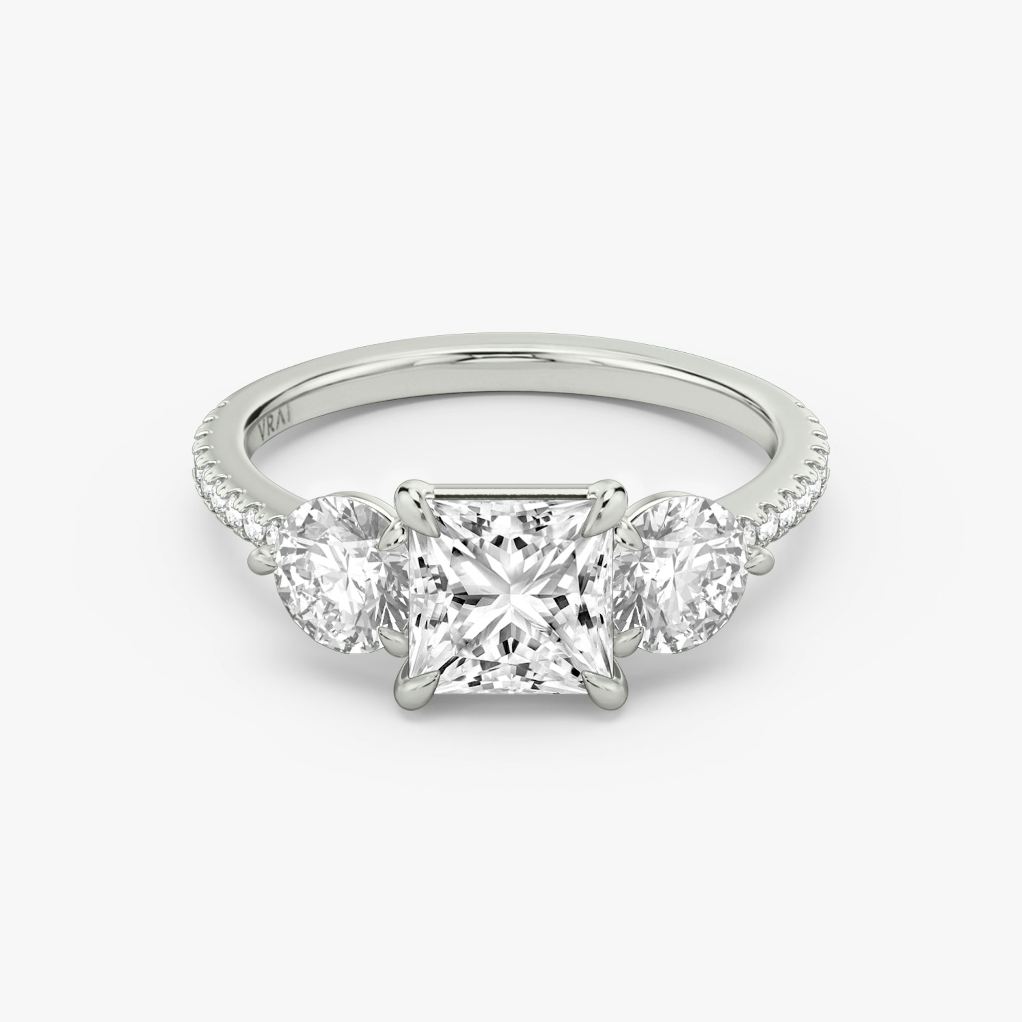 The Three Stone | Princess | Platinum | bandAccent: Pavé | sideStoneCarat: 0.50ct | sideStoneShape: Round Brilliant | diamondOrientation: vertical | caratWeight: other
