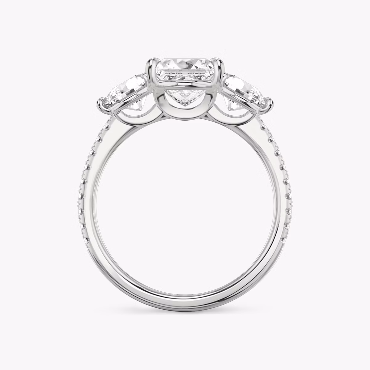 The Three Stone | Princess | Platinum | bandAccent: Pavé | sideStoneCarat: 0.50ct | sideStoneShape: Round Brilliant | diamondOrientation: vertical | caratWeight: other