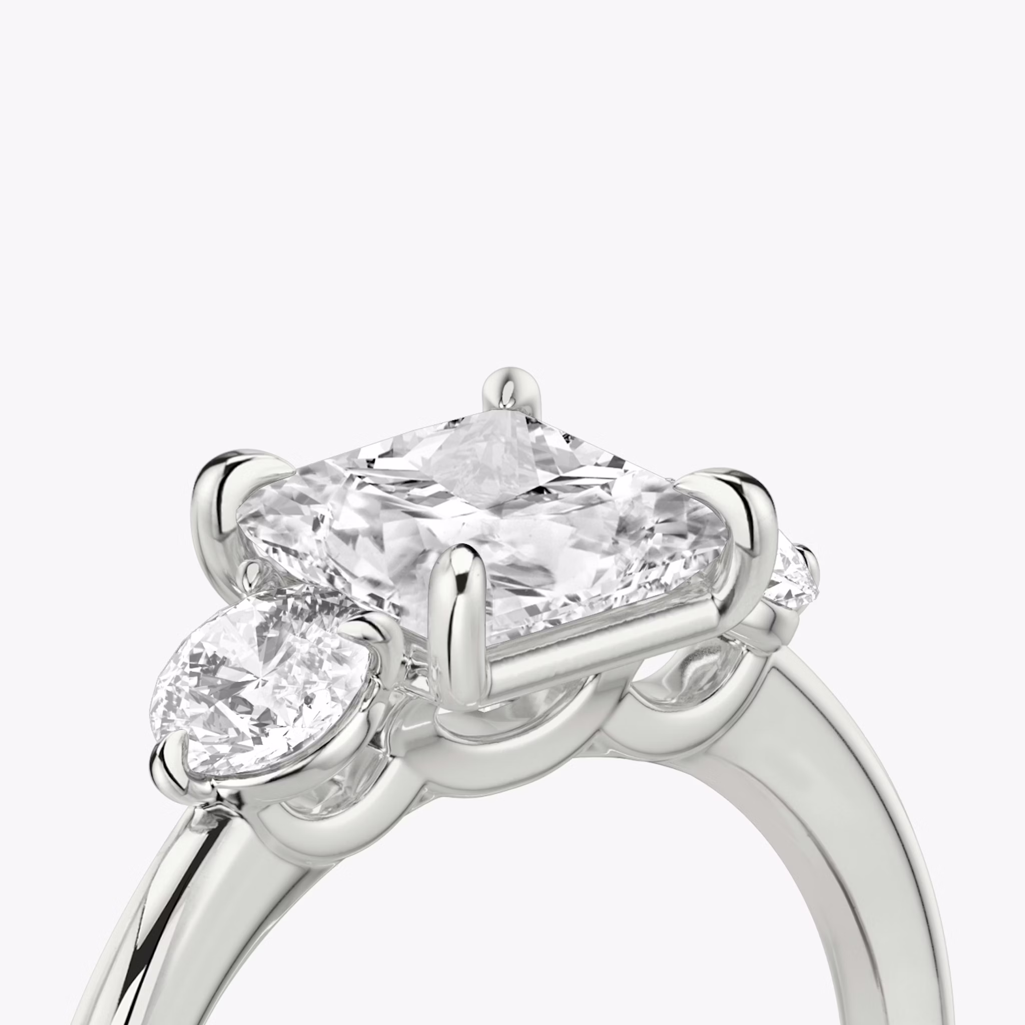 The Three Stone | Princess | 18k | White Gold | bandAccent: Plain | sideStoneCarat: 0.25ct | sideStoneShape: Round Brilliant | diamondOrientation: vertical | caratWeight: other