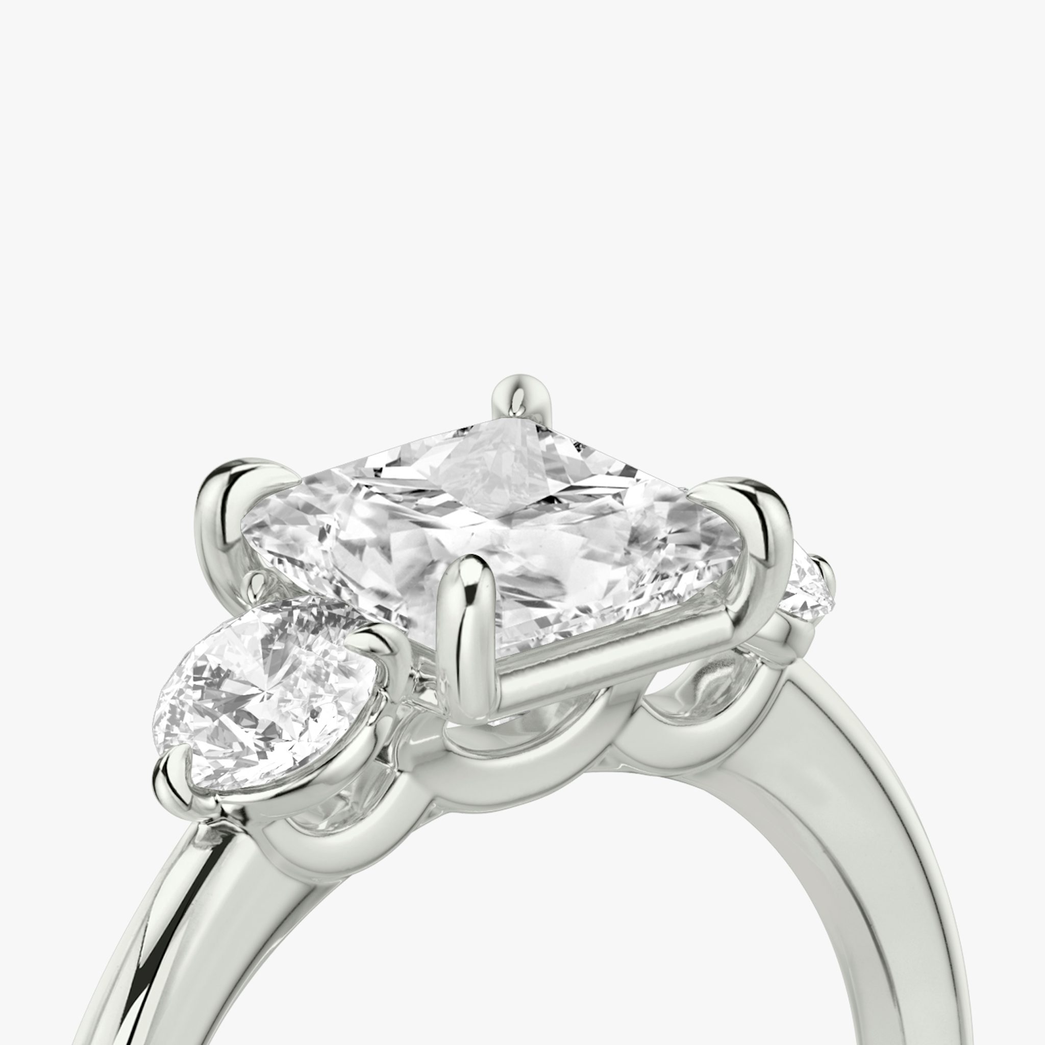The Three Stone | Princess | 18k | White Gold | bandAccent: Plain | sideStoneCarat: 0.25ct | sideStoneShape: Round Brilliant | diamondOrientation: vertical | caratWeight: other