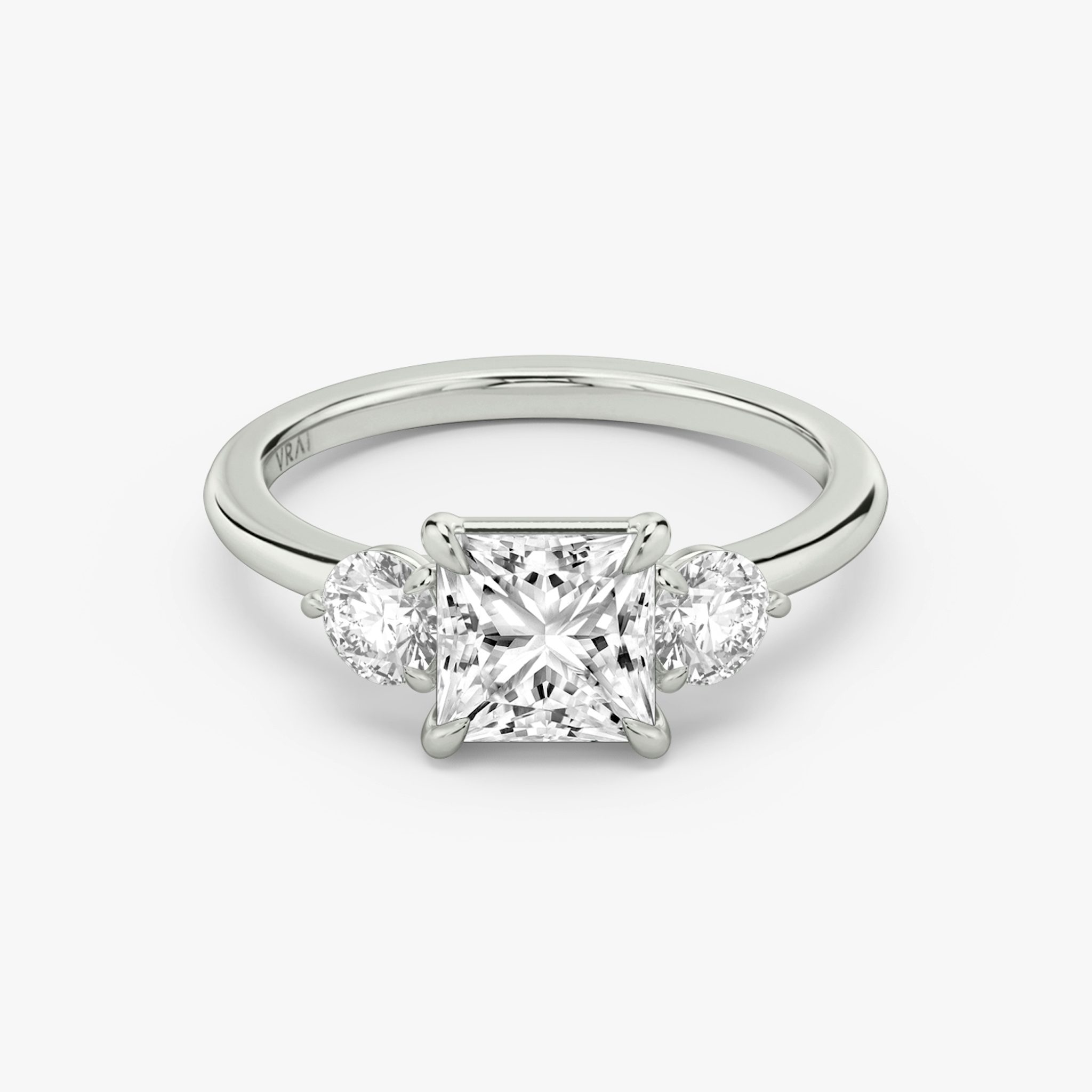 The Three Stone | Princess | 18k | White Gold | bandAccent: Plain | sideStoneCarat: 0.25ct | sideStoneShape: Round Brilliant | diamondOrientation: vertical | caratWeight: other