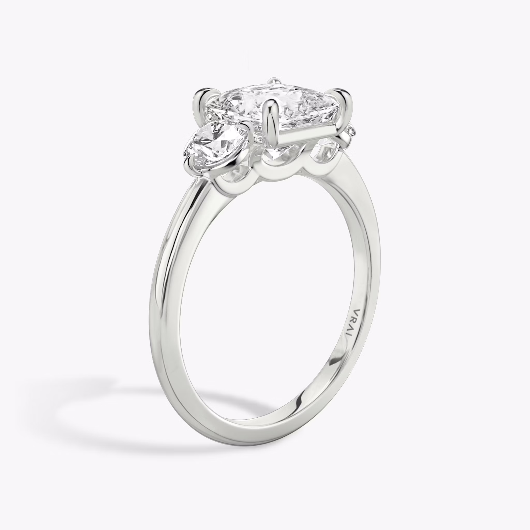 The Three Stone | Princess | 18k | White Gold | bandAccent: Plain | sideStoneCarat: 0.25ct | sideStoneShape: Round Brilliant | diamondOrientation: vertical | caratWeight: other