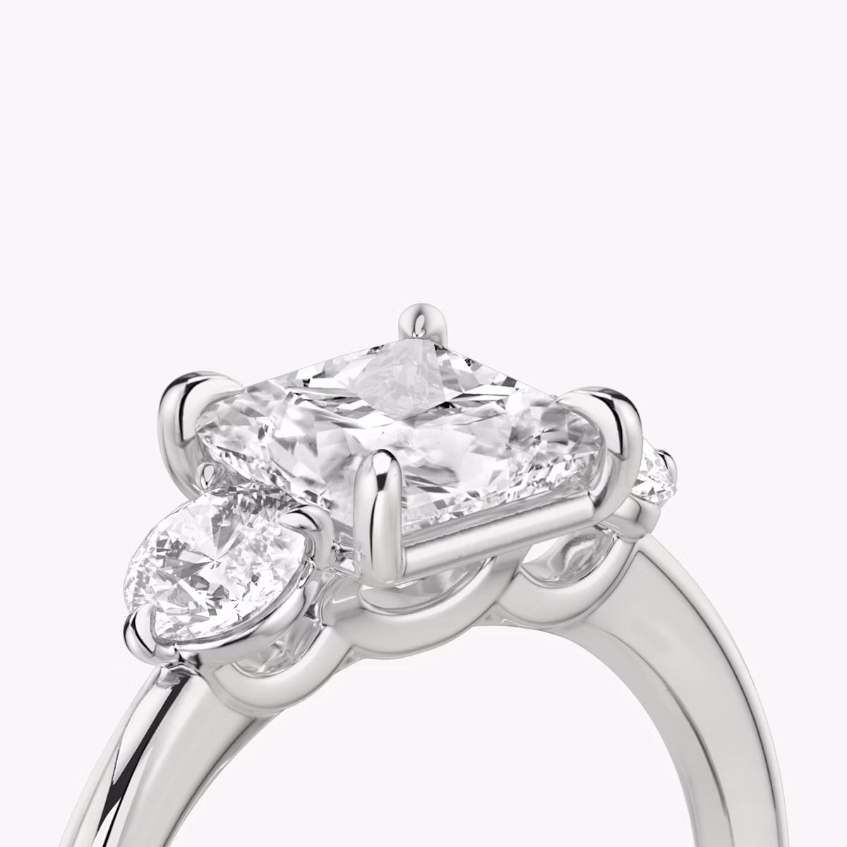 The Three Stone | Princess | Platinum | bandAccent: Plain | sideStoneCarat: 0.25ct | sideStoneShape: Round Brilliant | diamondOrientation: vertical | caratWeight: other