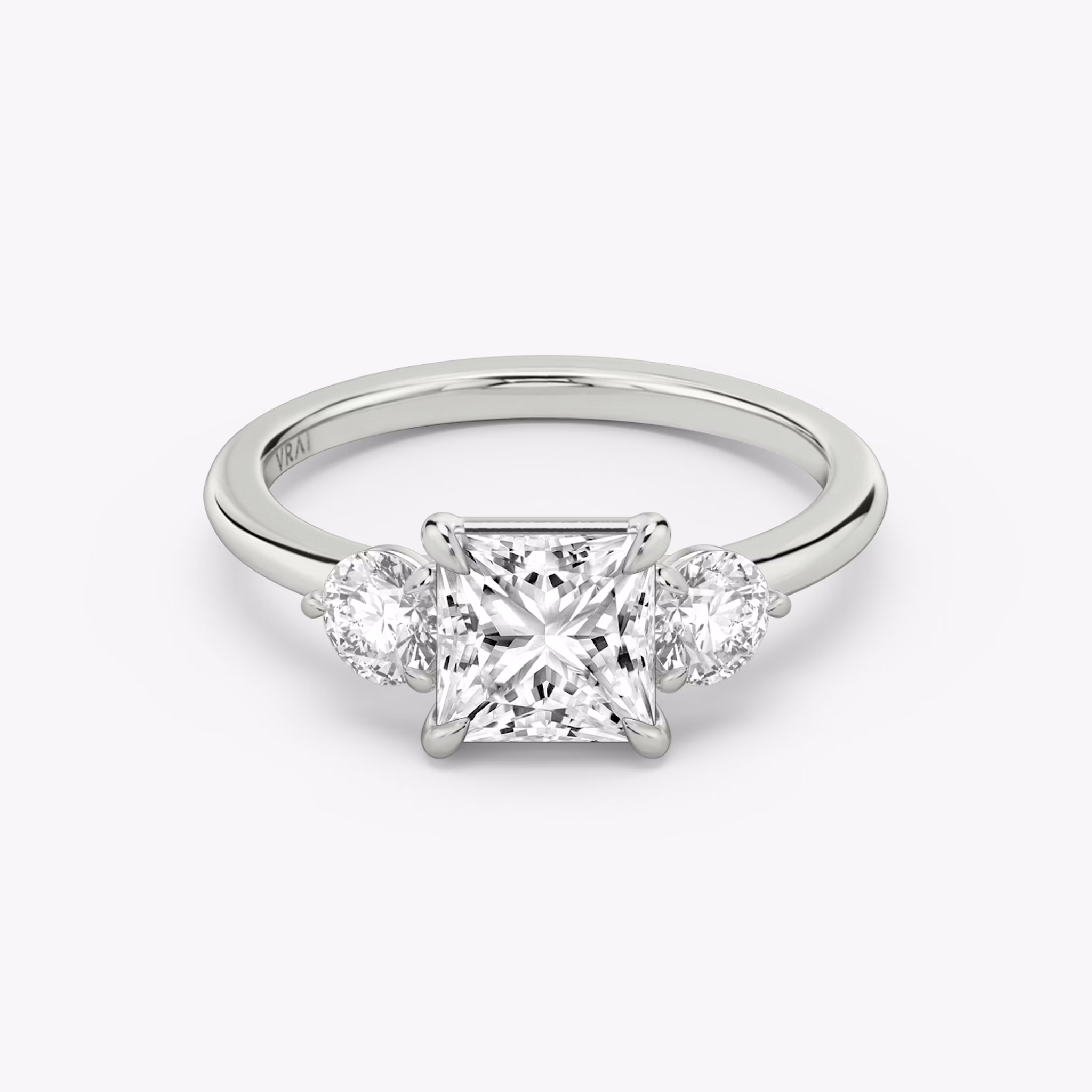 The Three Stone | Princess | Platinum | bandAccent: Plain | sideStoneCarat: 0.25ct | sideStoneShape: Round Brilliant | diamondOrientation: vertical | caratWeight: other