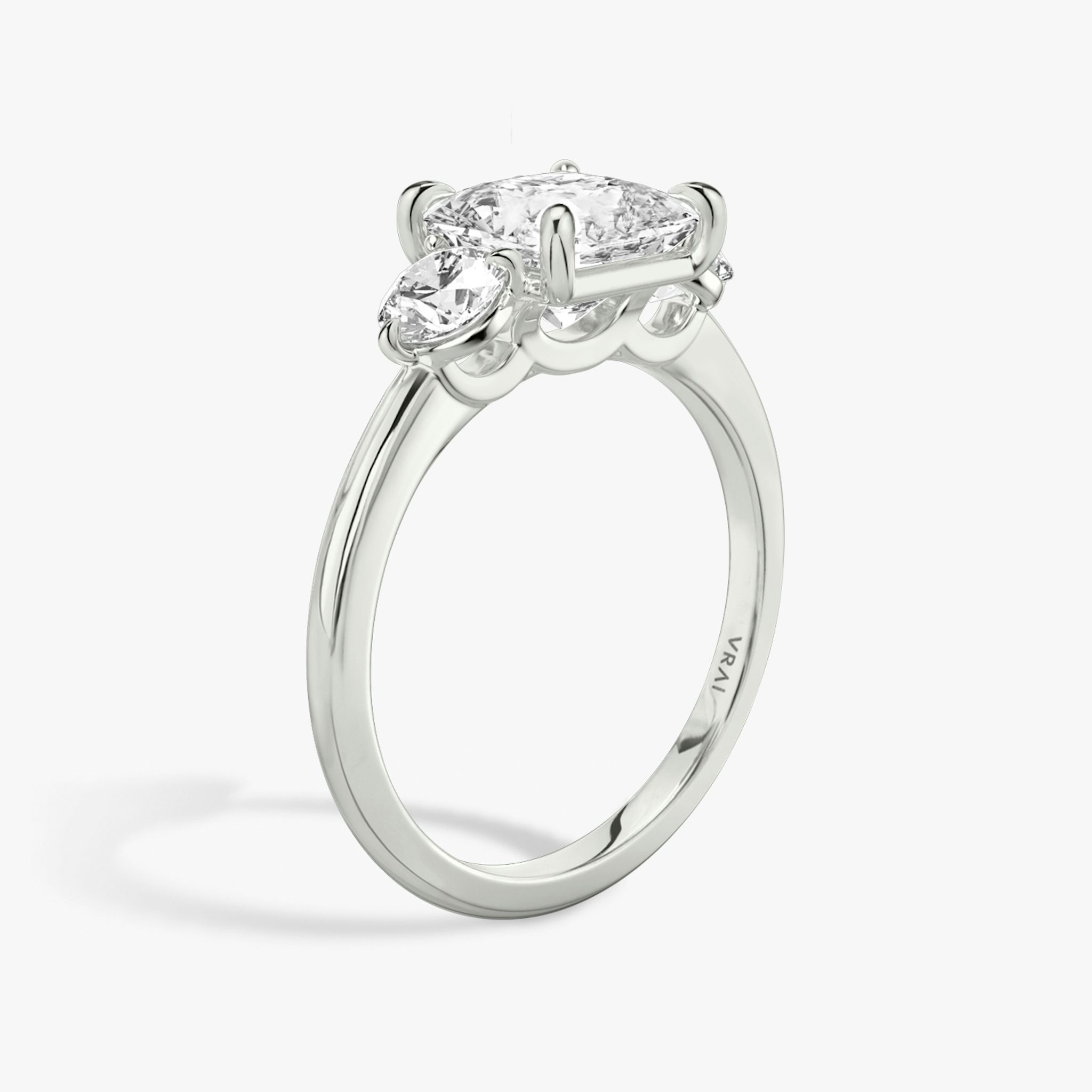The Three Stone | Princess | Platinum | bandAccent: Plain | sideStoneCarat: 0.25ct | sideStoneShape: Round Brilliant | diamondOrientation: vertical | caratWeight: other