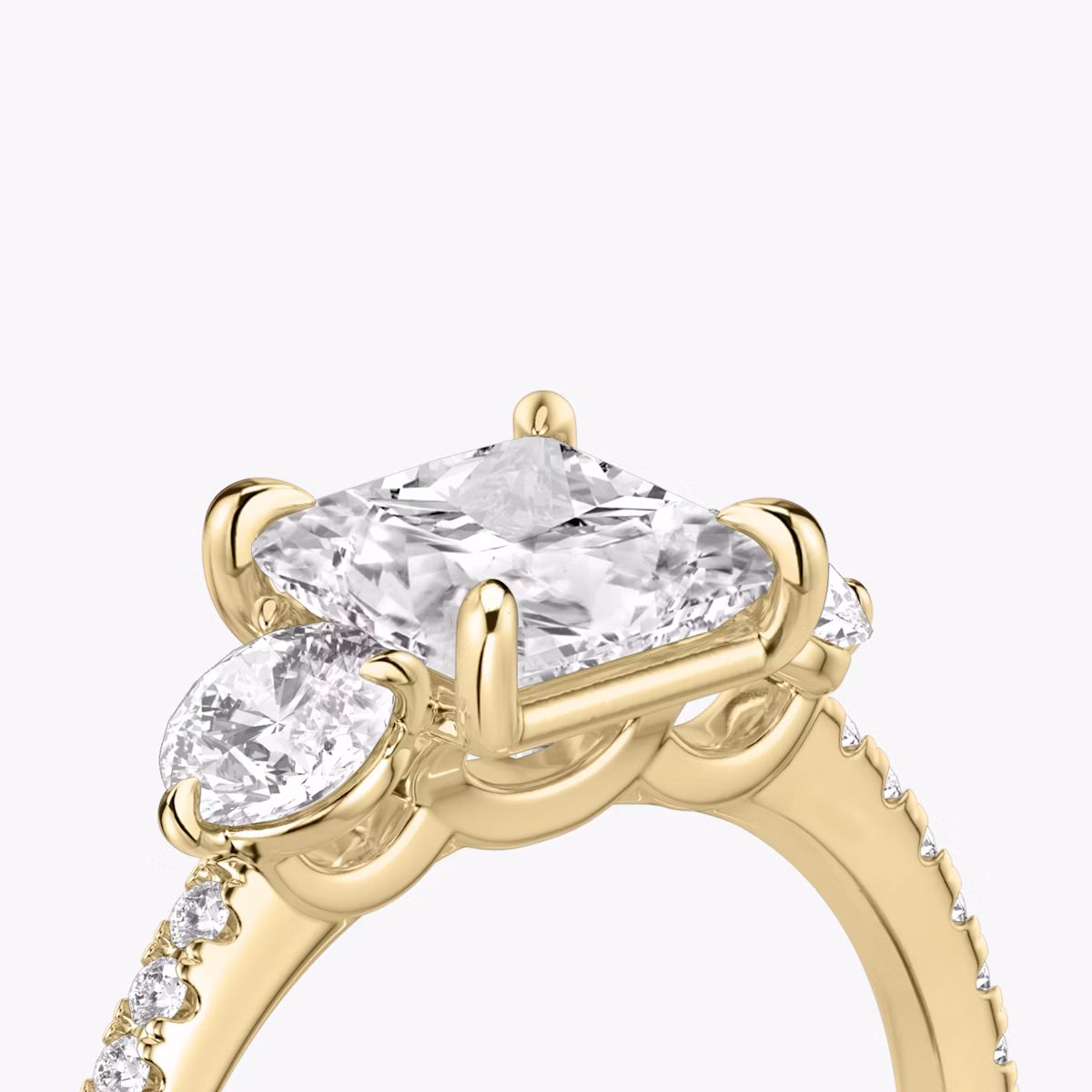 The Three Stone | Princess | 18k | Yellow Gold | bandAccent: Pavé | sideStoneCarat: 0.25ct | sideStoneShape: Round Brilliant | diamondOrientation: vertical | caratWeight: other