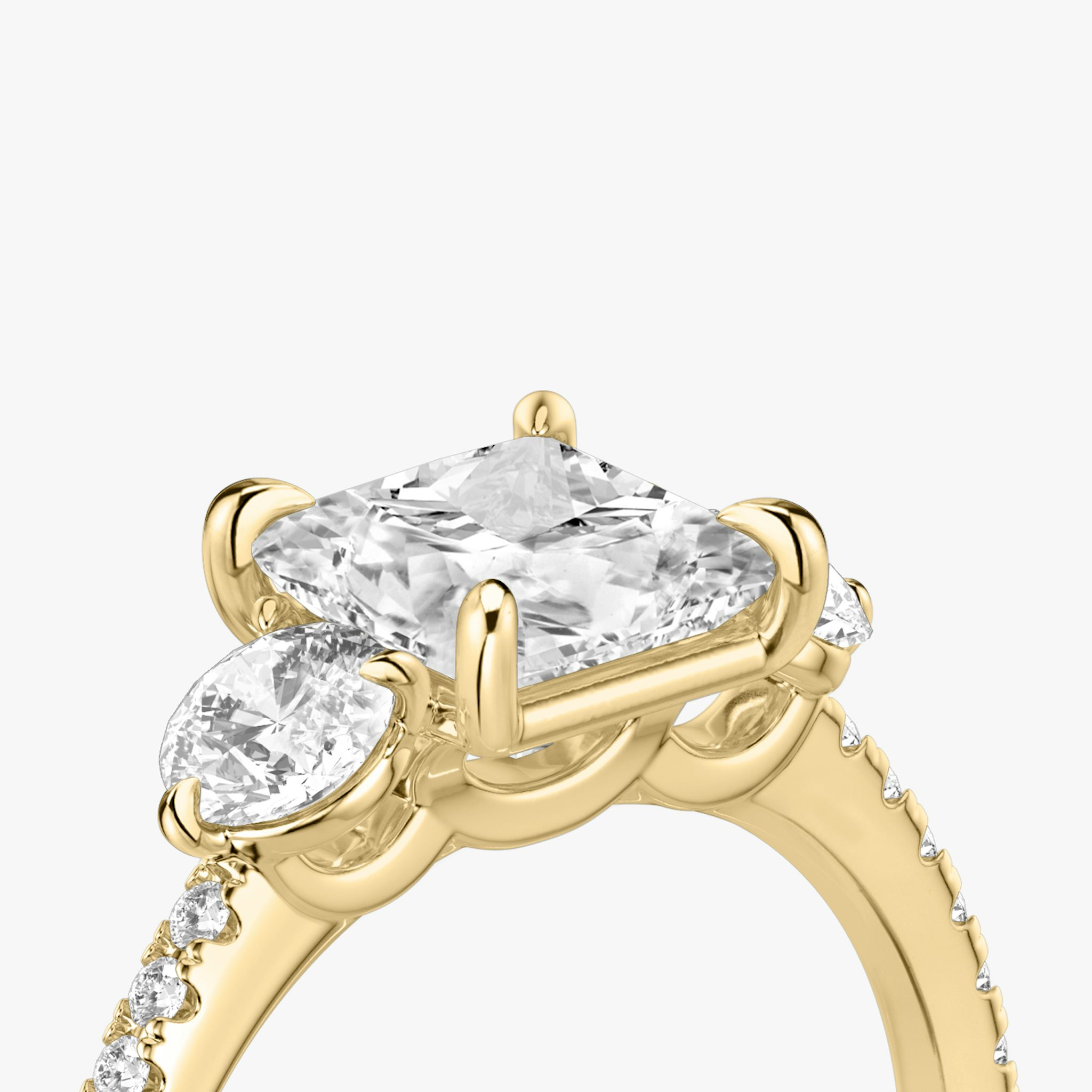 The Three Stone | Princess | 18k | Yellow Gold | bandAccent: Pavé | sideStoneCarat: 0.25ct | sideStoneShape: Round Brilliant | diamondOrientation: vertical | caratWeight: other