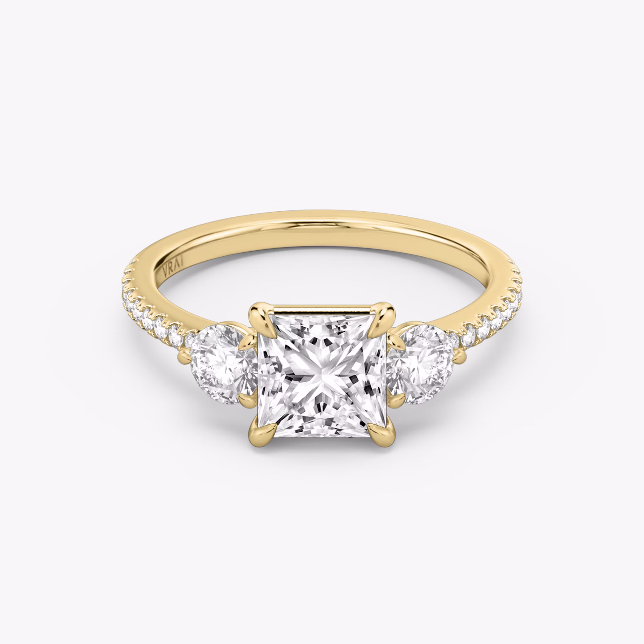 The Three Stone | Princess | 18k | Yellow Gold | bandAccent: Pavé | sideStoneCarat: 0.25ct | sideStoneShape: Round Brilliant | diamondOrientation: vertical | caratWeight: other
