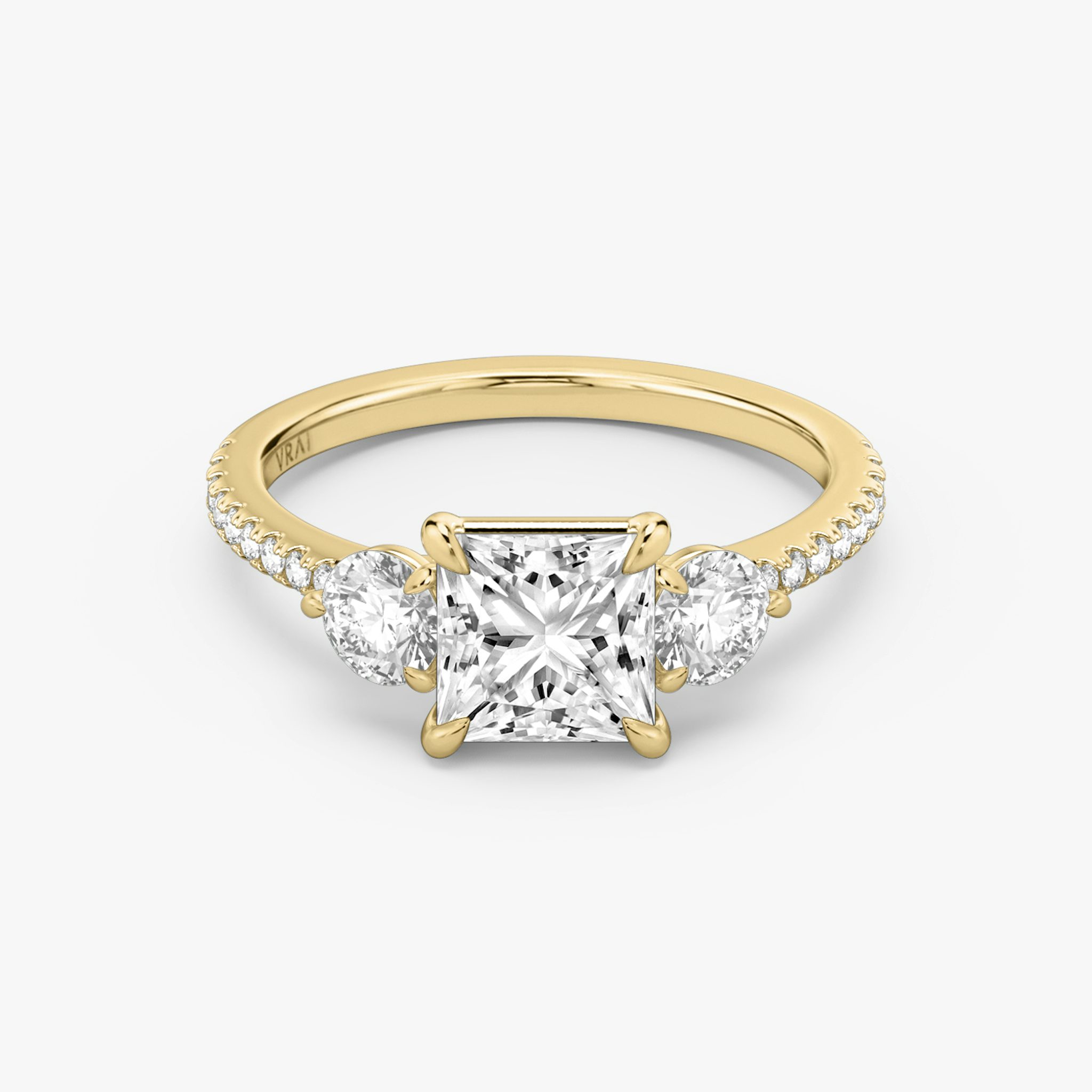 The Three Stone | Princess | 18k | Yellow Gold | bandAccent: Pavé | sideStoneCarat: 0.25ct | sideStoneShape: Round Brilliant | diamondOrientation: vertical | caratWeight: other