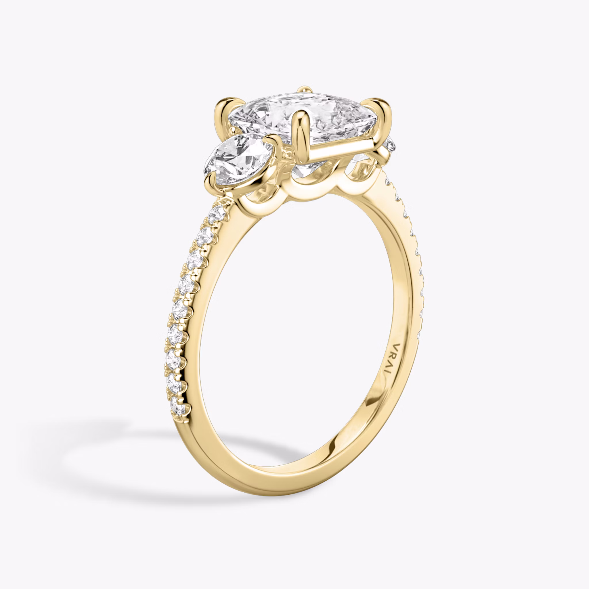 The Three Stone | Princess | 18k | Yellow Gold | bandAccent: Pavé | sideStoneCarat: 0.25ct | sideStoneShape: Round Brilliant | diamondOrientation: vertical | caratWeight: other
