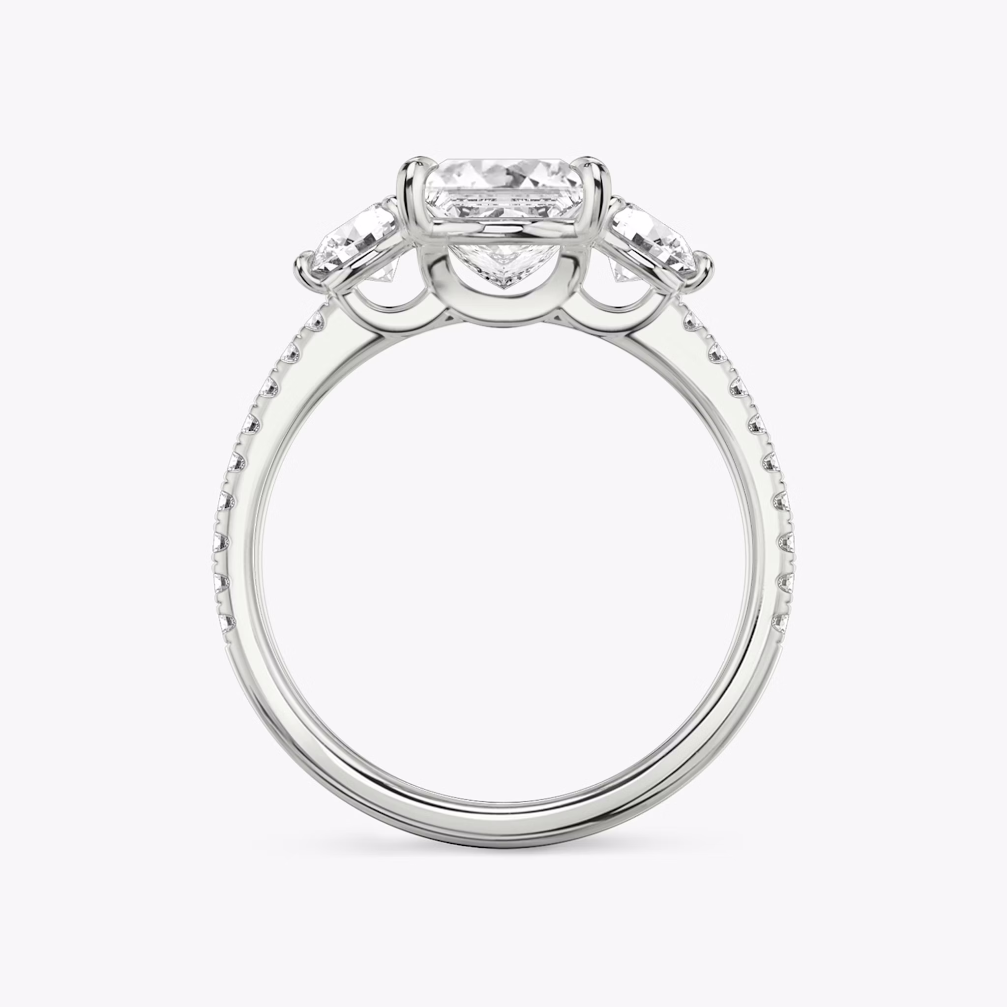The Three Stone | Princess | 18k | White Gold | bandAccent: Pavé | sideStoneCarat: 0.25ct | sideStoneShape: Round Brilliant | diamondOrientation: vertical | caratWeight: other