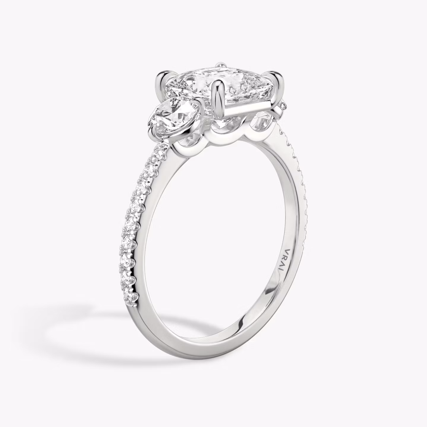 The Three Stone | Princess | 18k | White Gold | bandAccent: Pavé | sideStoneCarat: 0.25ct | sideStoneShape: Round Brilliant | diamondOrientation: vertical | caratWeight: other