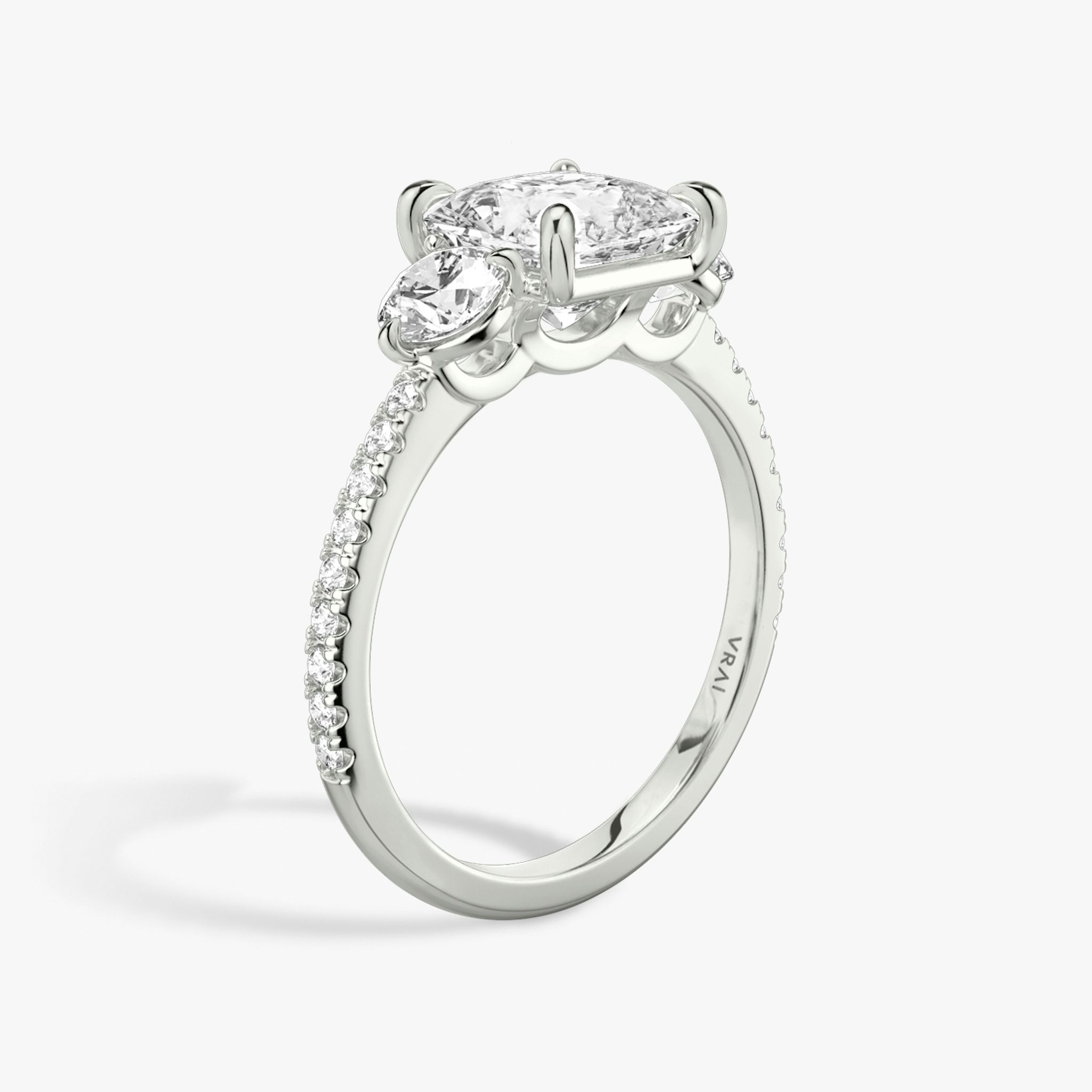 The Three Stone | Princess | 18k | White Gold | bandAccent: Pavé | sideStoneCarat: 0.25ct | sideStoneShape: Round Brilliant | diamondOrientation: vertical | caratWeight: other