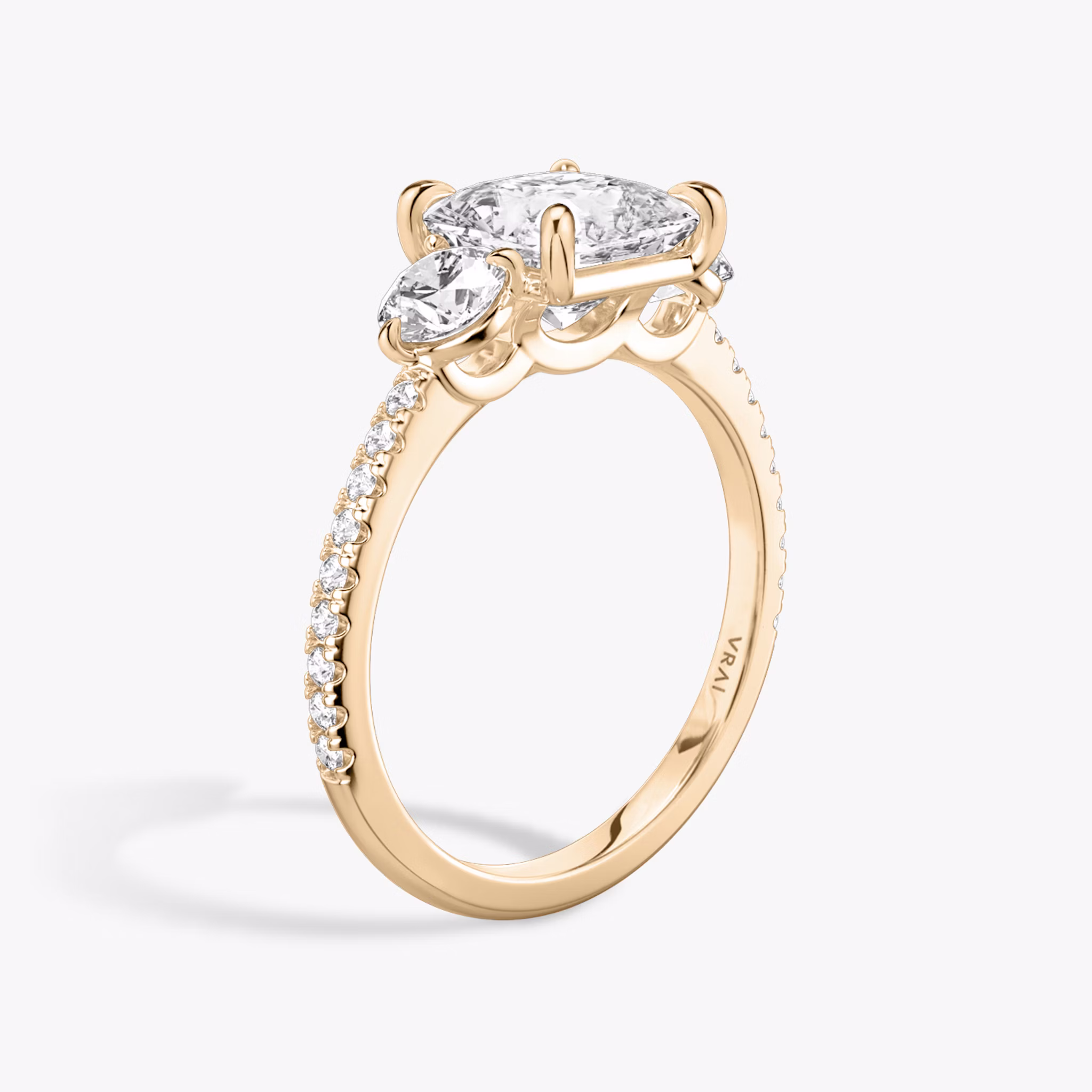 The Three Stone | Princess | 14k | Rose Gold | bandAccent: Pavé | sideStoneCarat: 0.25ct | sideStoneShape: Round Brilliant | diamondOrientation: vertical | caratWeight: other