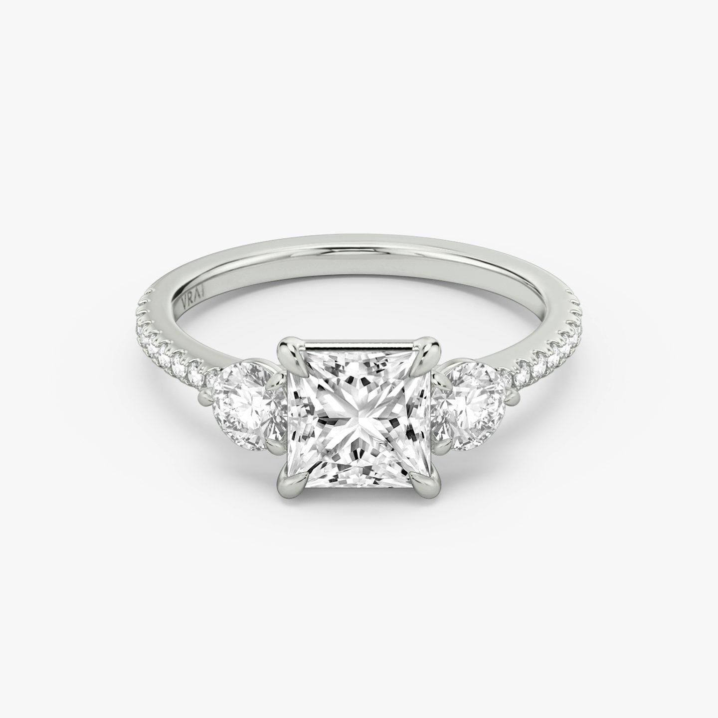 The Three Stone | Princess | Platinum | bandAccent: Pavé | sideStoneCarat: 0.25ct | sideStoneShape: Round Brilliant | diamondOrientation: vertical | caratWeight: other