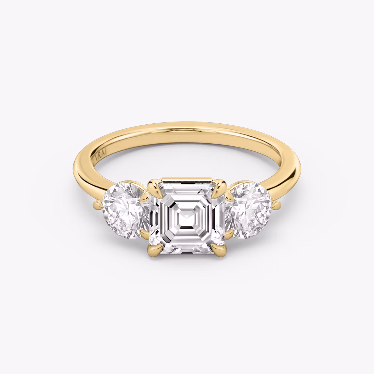 The Three Stone | Asscher | 18k | Yellow Gold | bandAccent: Plain | sideStoneCarat: 0.50ct | sideStoneShape: Round Brilliant | diamondOrientation: vertical | caratWeight: other