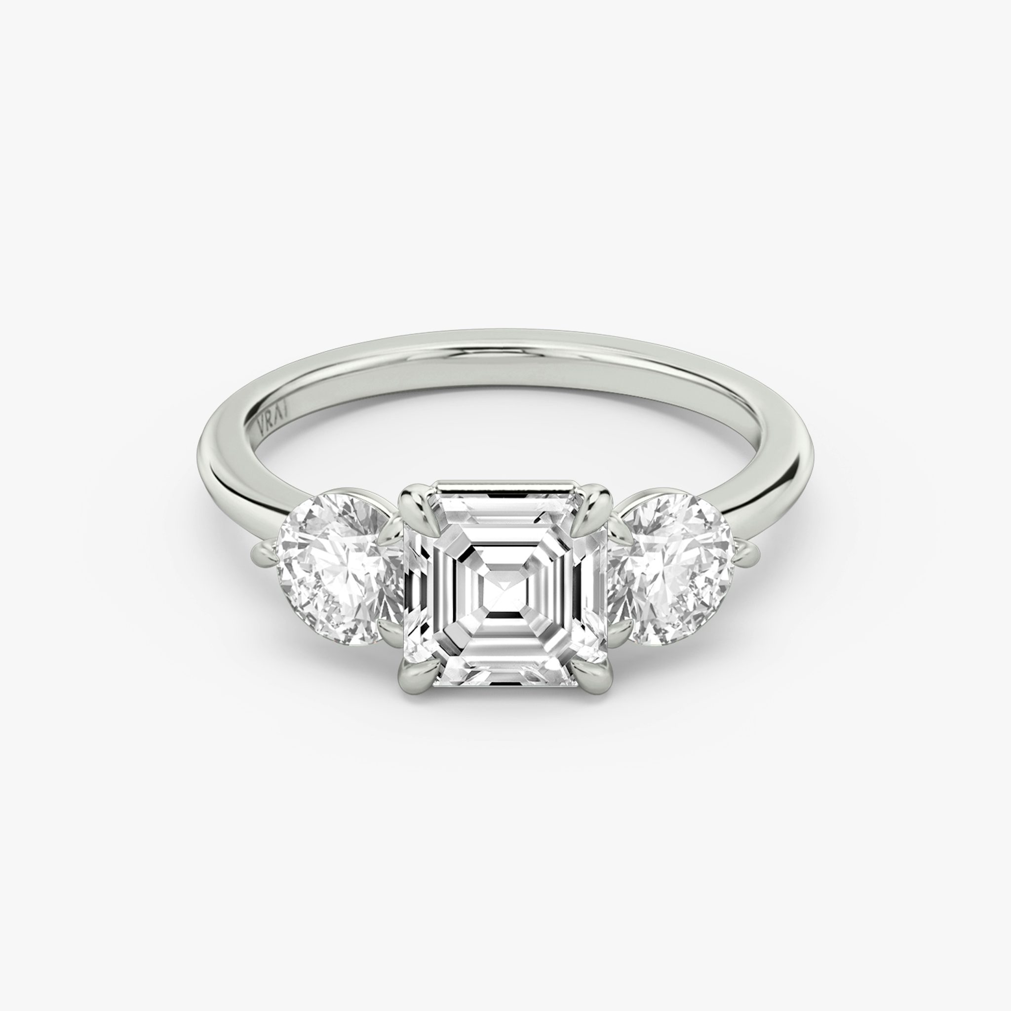 The Three Stone | Asscher | 18k | White Gold | bandAccent: Plain | sideStoneCarat: 0.50ct | sideStoneShape: Round Brilliant | diamondOrientation: vertical | caratWeight: other