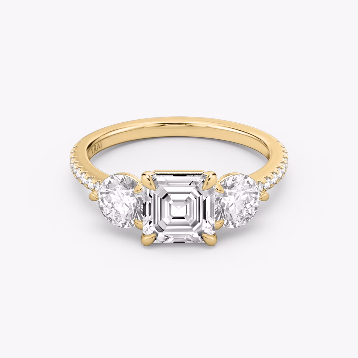 The Three Stone | Asscher | 18k | Yellow Gold | bandAccent: Pavé | sideStoneCarat: 0.50ct | sideStoneShape: Round Brilliant | diamondOrientation: vertical | caratWeight: other