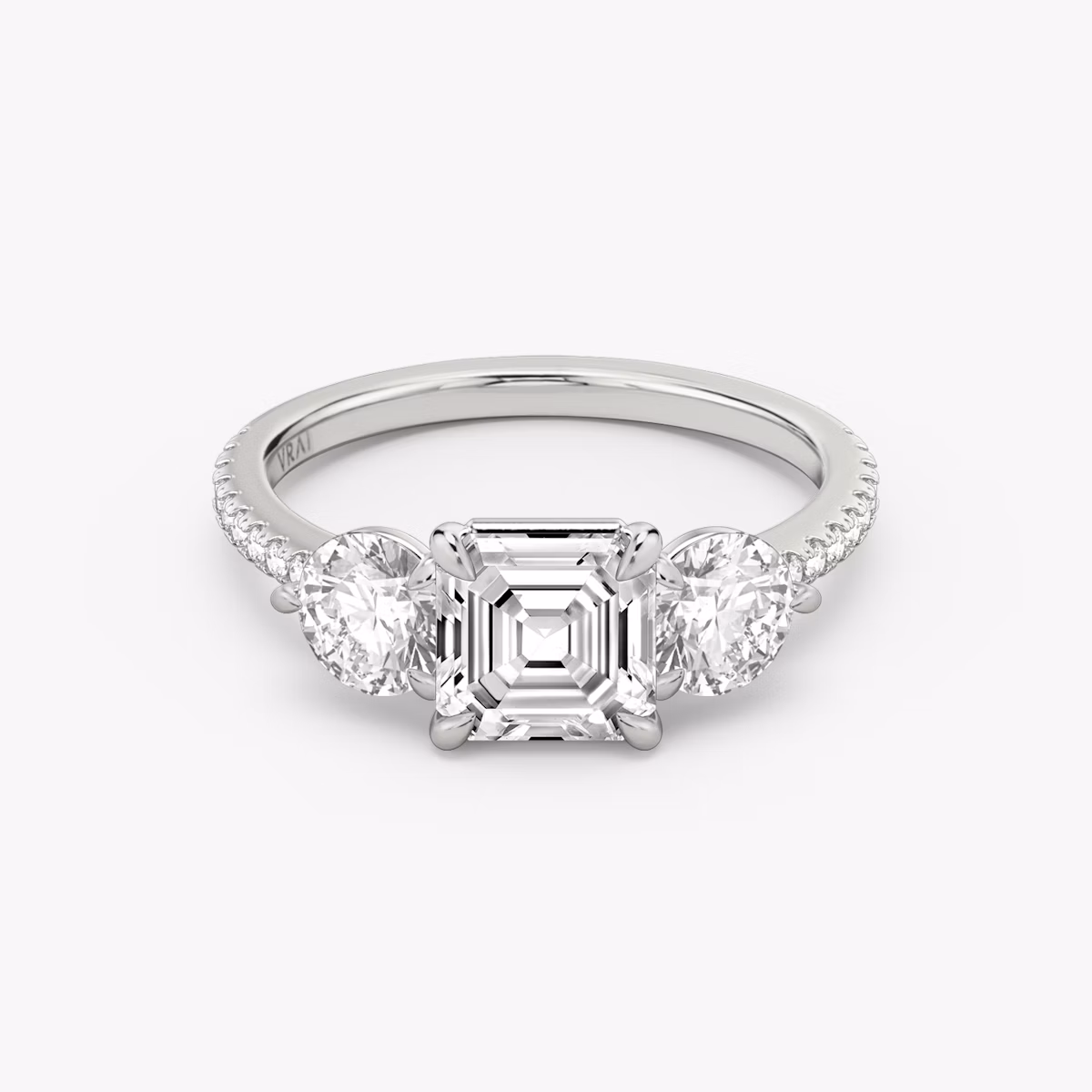 The Three Stone | Asscher | 18k | White Gold | bandAccent: Pavé | sideStoneCarat: 0.50ct | sideStoneShape: Round Brilliant | diamondOrientation: vertical | caratWeight: other