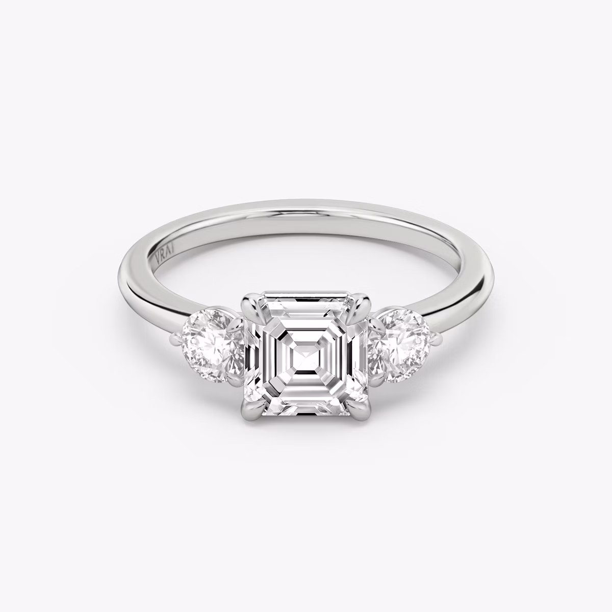 The Three Stone | Asscher | Platinum | bandAccent: Plain | sideStoneCarat: 0.25ct | sideStoneShape: Round Brilliant | diamondOrientation: vertical | caratWeight: other