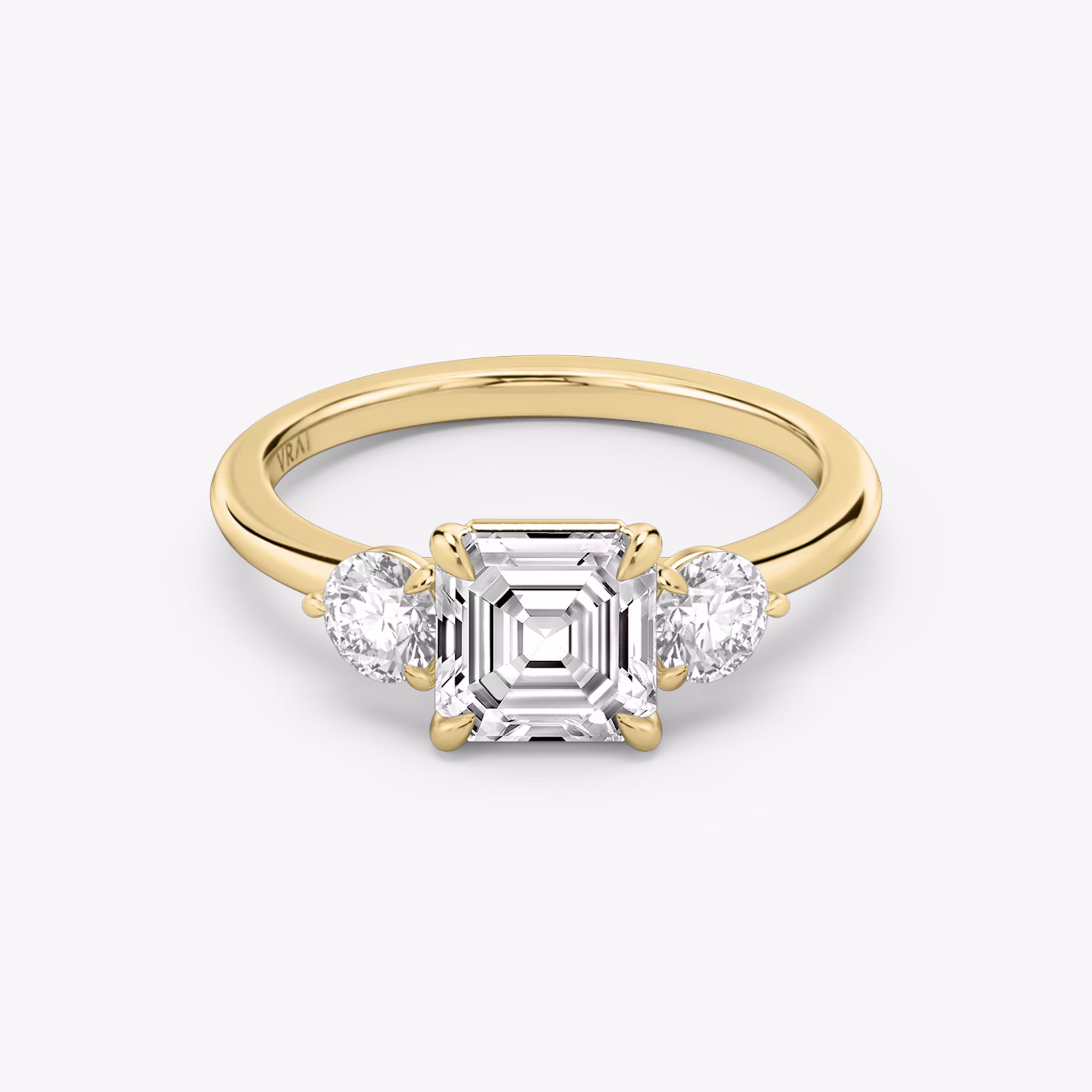 The Three Stone | Asscher | 18k | Yellow Gold | bandAccent: Plain | sideStoneCarat: 0.25ct | sideStoneShape: Round Brilliant | diamondOrientation: vertical | caratWeight: other