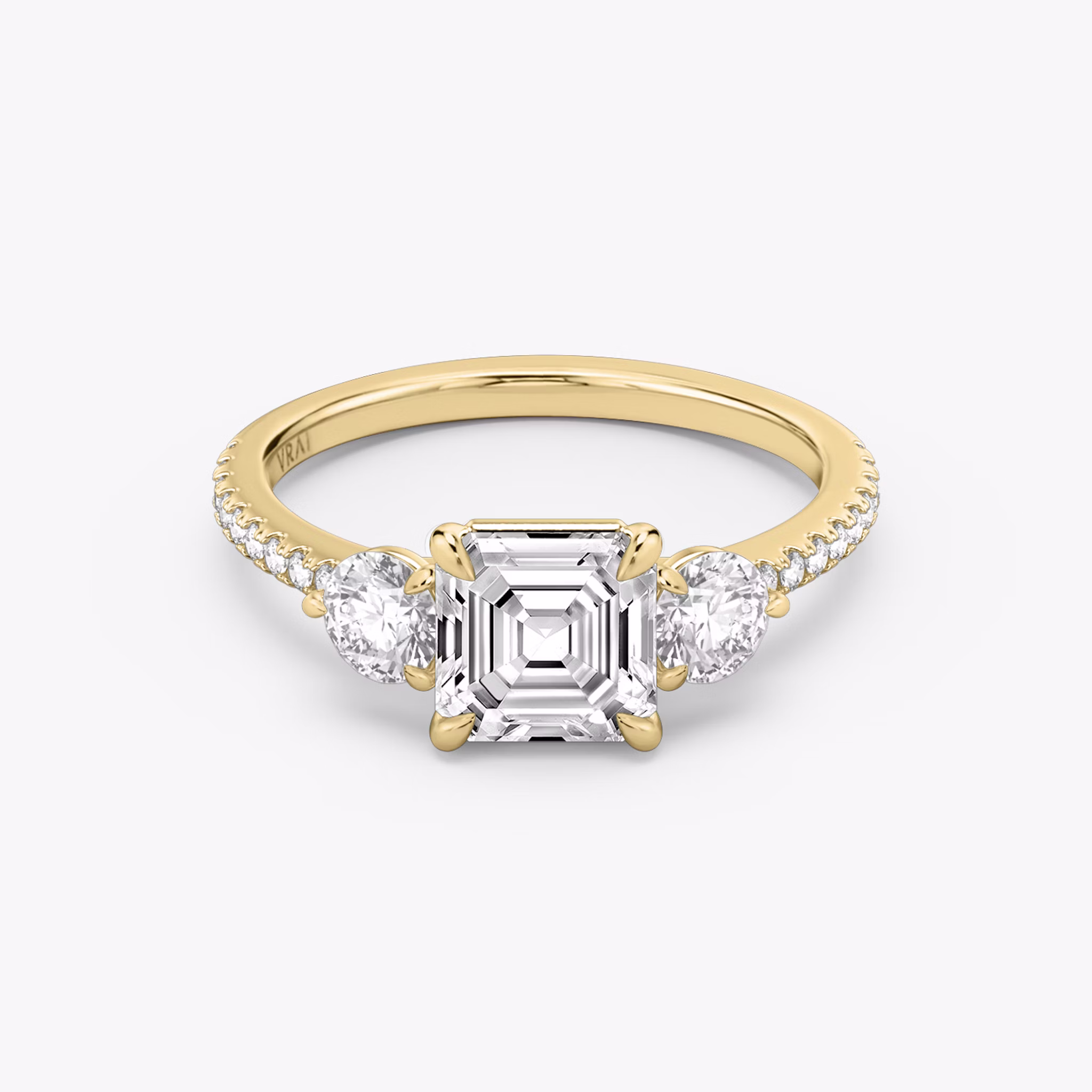 The Three Stone | Asscher | 18k | Yellow Gold | bandAccent: Pavé | sideStoneCarat: 0.25ct | sideStoneShape: Round Brilliant | diamondOrientation: vertical | caratWeight: other