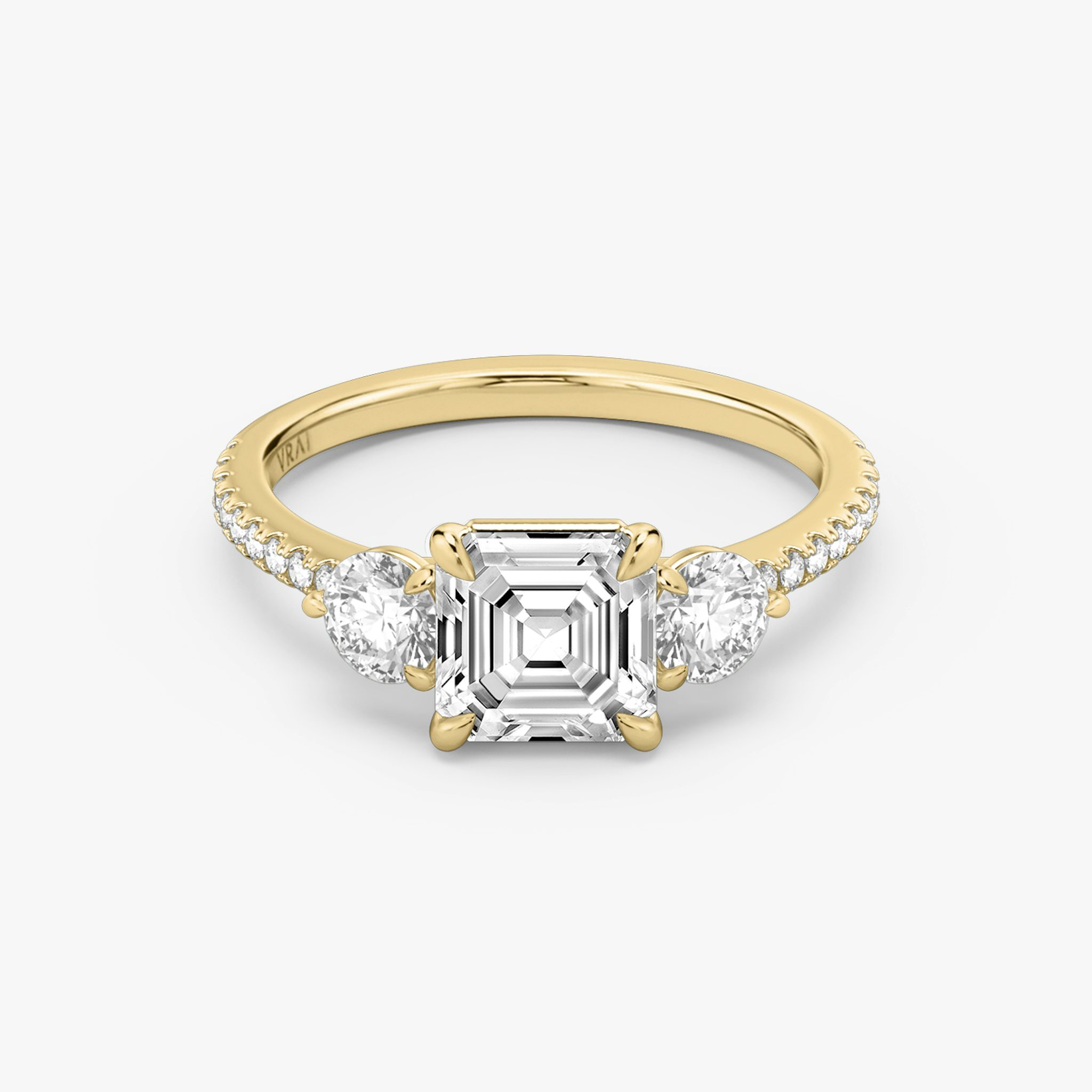 The Three Stone | Asscher | 18k | Yellow Gold | bandAccent: Pavé | sideStoneCarat: 0.25ct | sideStoneShape: Round Brilliant | diamondOrientation: vertical | caratWeight: other