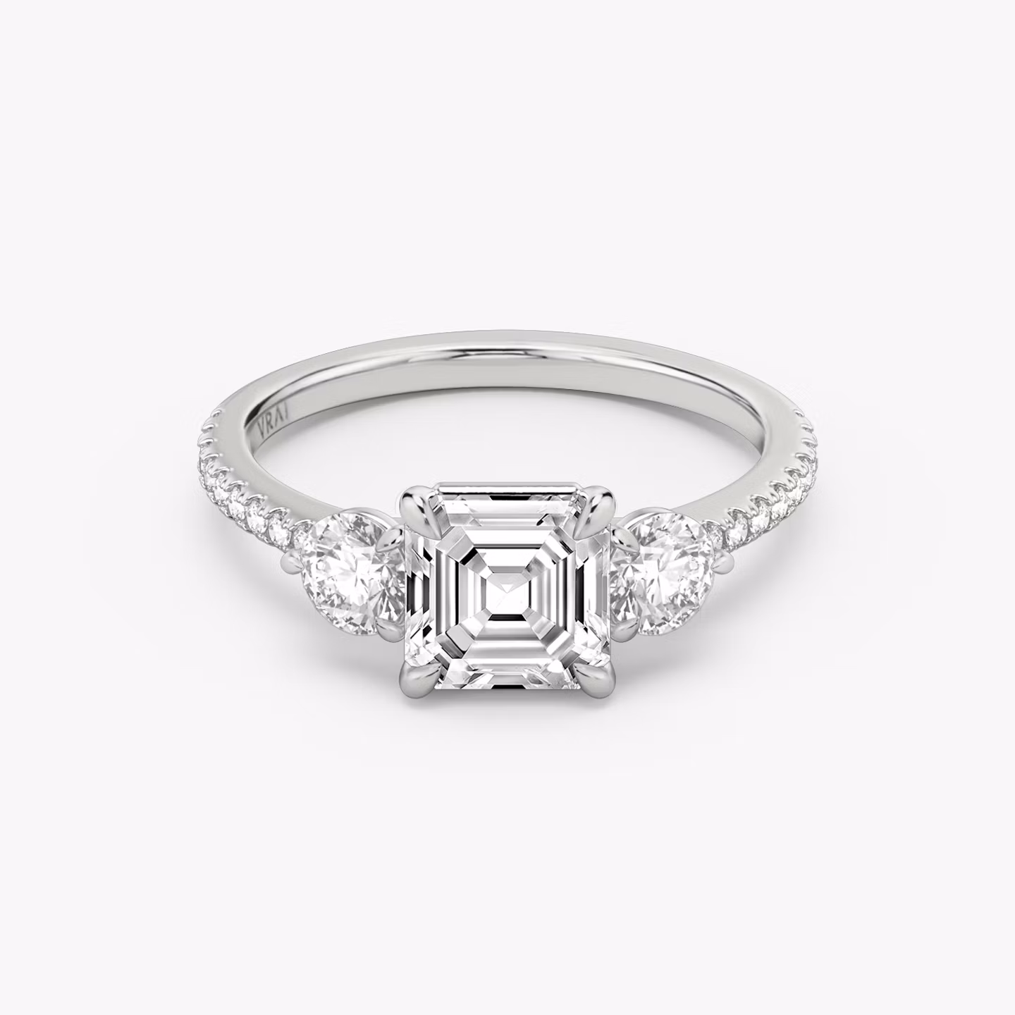 The Three Stone | Asscher | 18k | White Gold | bandAccent: Pavé | sideStoneCarat: 0.25ct | sideStoneShape: Round Brilliant | diamondOrientation: vertical | caratWeight: other