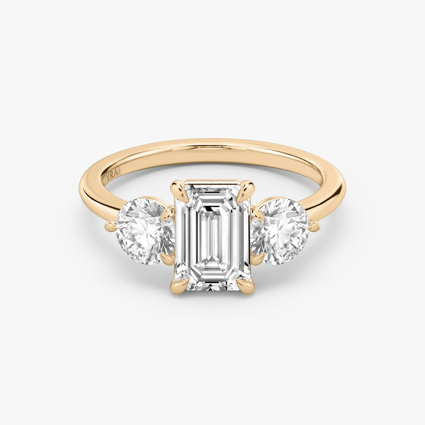 The Three Stone | Emerald | 14k | Rose Gold | bandAccent: Plain | sideStoneCarat: 0.50ct | sideStoneShape: Round Brilliant | diamondOrientation: vertical | caratWeight: other
