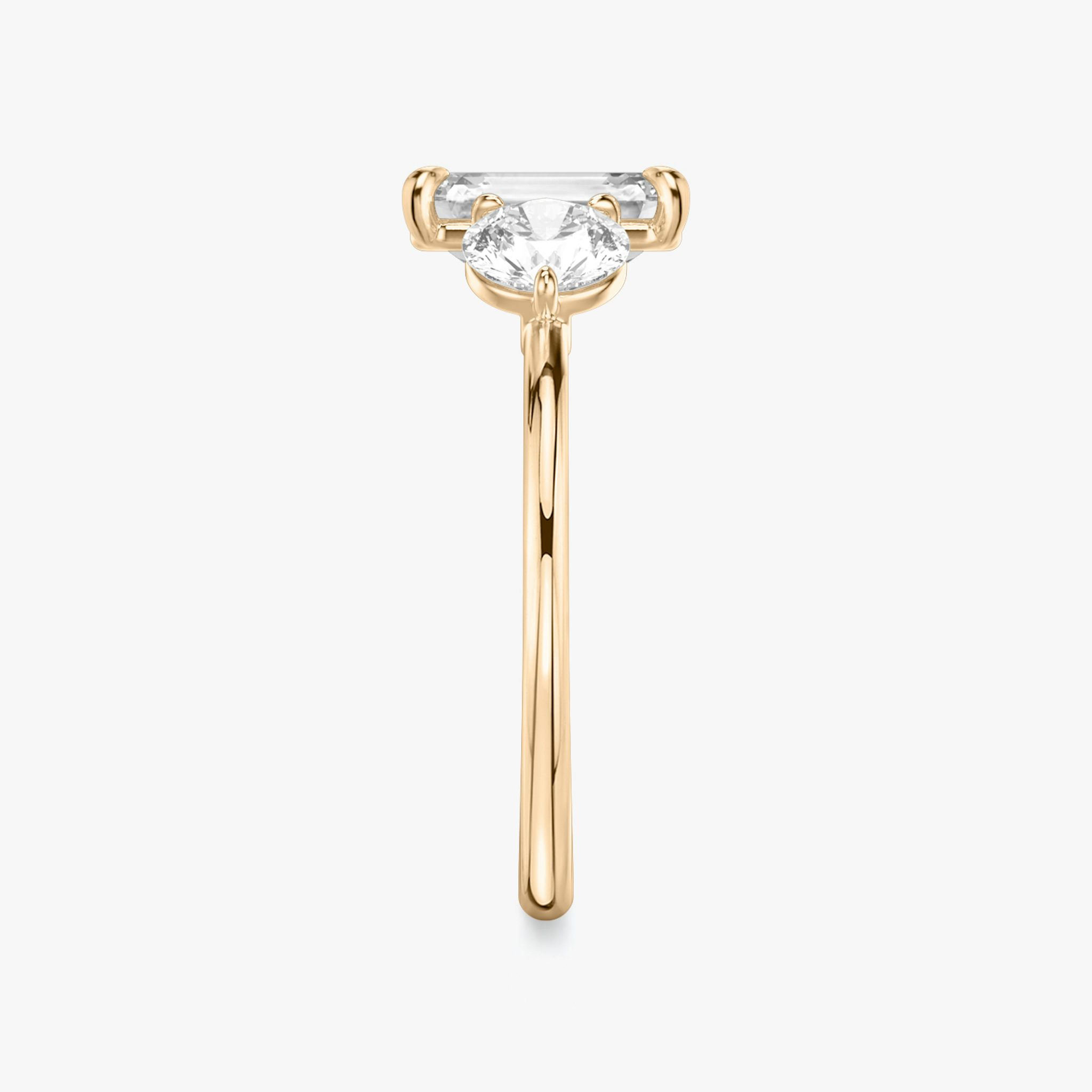 The Three Stone | Emerald | 14k | Rose Gold | bandAccent: Plain | sideStoneCarat: 0.50ct | sideStoneShape: Round Brilliant | diamondOrientation: vertical | caratWeight: other
