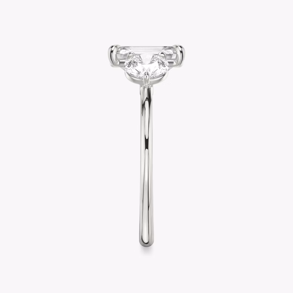 The Three Stone | Emerald | Platinum | bandAccent: Plain | sideStoneCarat: 0.50ct | sideStoneShape: Round Brilliant | diamondOrientation: vertical | caratWeight: other