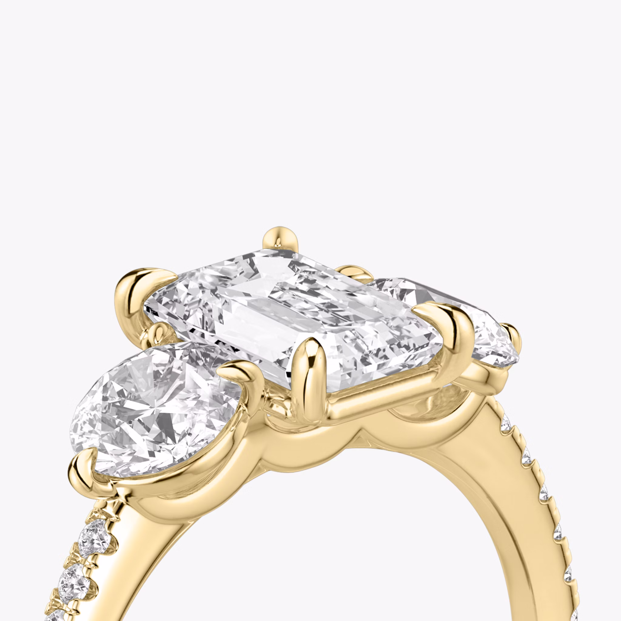 The Three Stone | Emerald | 18k | Yellow Gold | bandAccent: Pavé | sideStoneCarat: 0.50ct | sideStoneShape: Round Brilliant | diamondOrientation: vertical | caratWeight: other