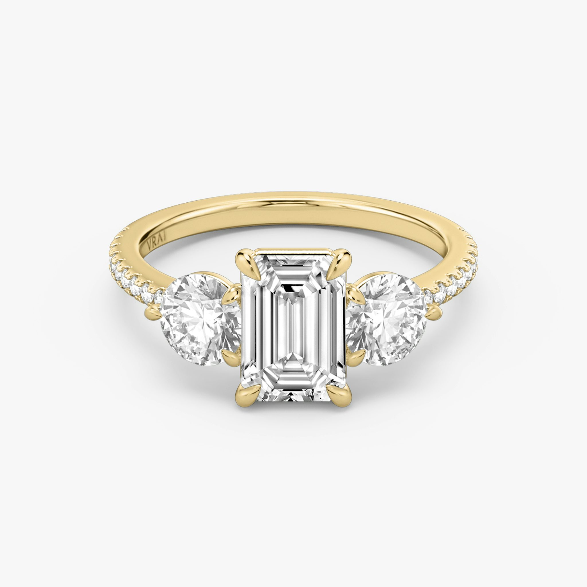 The Three Stone | Emerald | 18k | Yellow Gold | bandAccent: Pavé | sideStoneCarat: 0.50ct | sideStoneShape: Round Brilliant | diamondOrientation: vertical | caratWeight: other
