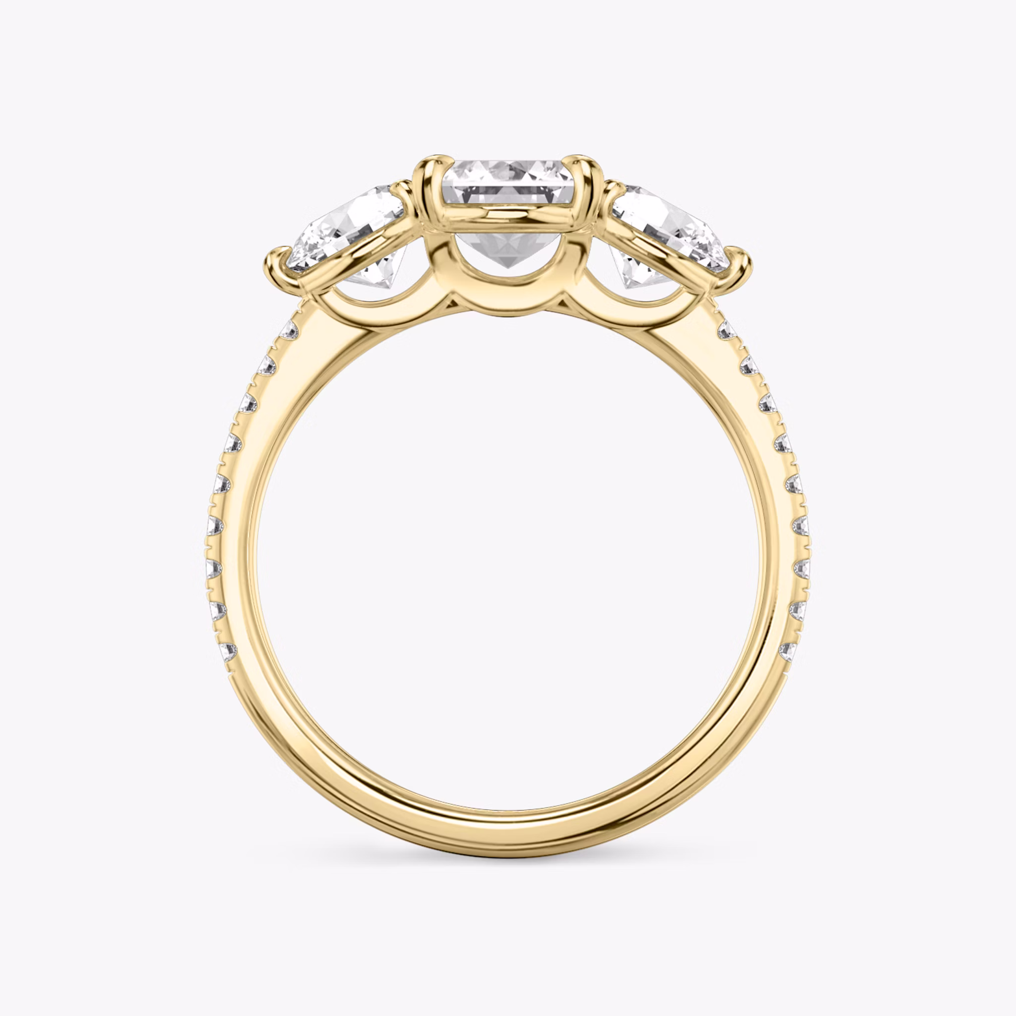 The Three Stone | Emerald | 18k | Yellow Gold | bandAccent: Pavé | sideStoneCarat: 0.50ct | sideStoneShape: Round Brilliant | diamondOrientation: vertical | caratWeight: other