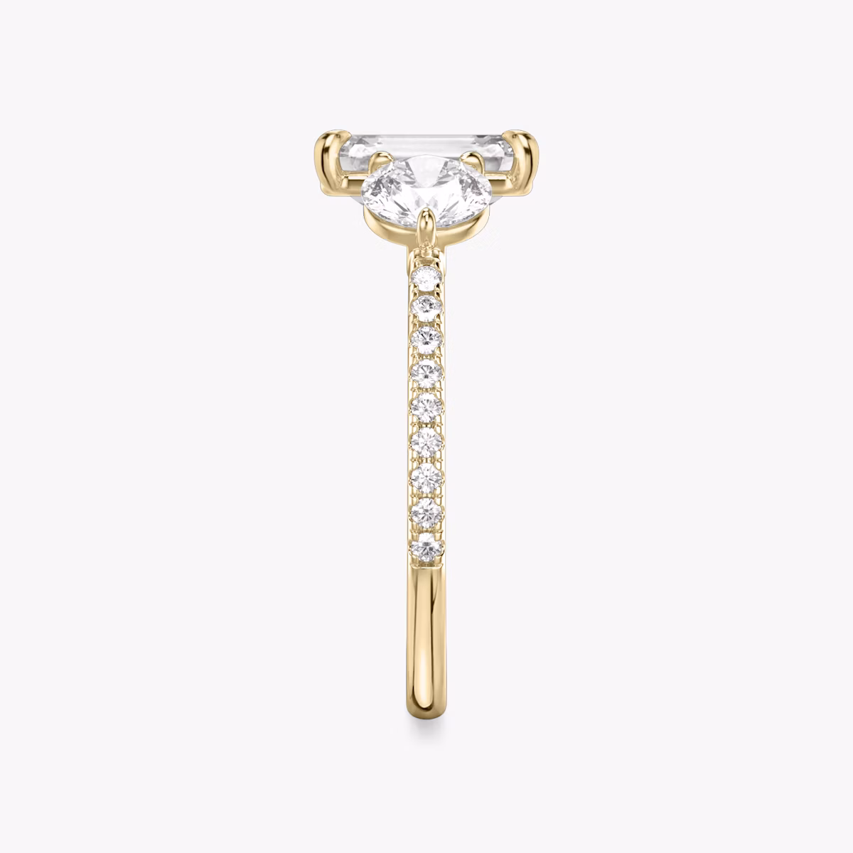 The Three Stone | Emerald | 18k | Yellow Gold | bandAccent: Pavé | sideStoneCarat: 0.50ct | sideStoneShape: Round Brilliant | diamondOrientation: vertical | caratWeight: other