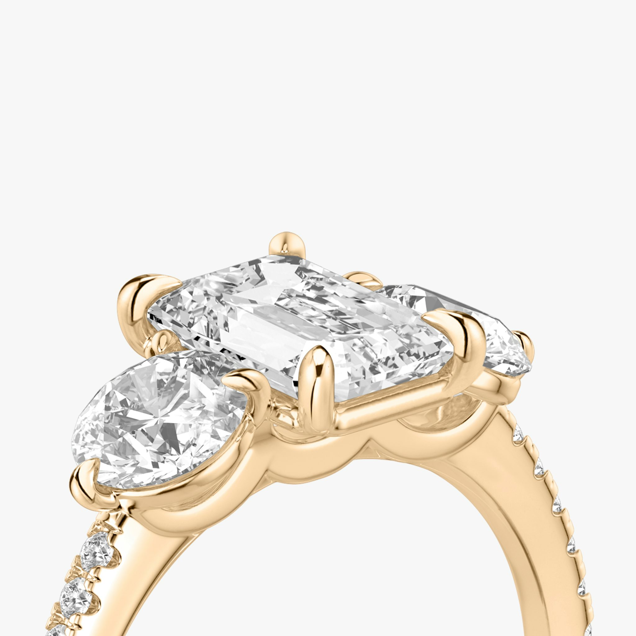 The Three Stone | Emerald | 14k | Rose Gold | bandAccent: Pavé | sideStoneCarat: 0.50ct | sideStoneShape: Round Brilliant | diamondOrientation: vertical | caratWeight: other