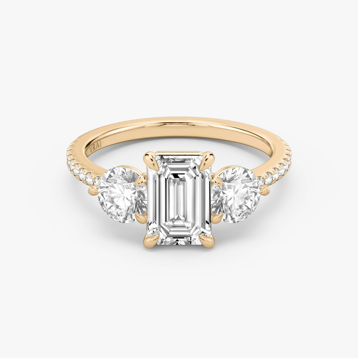 The Three Stone | Emerald | 14k | Rose Gold | bandAccent: Pavé | sideStoneCarat: 0.50ct | sideStoneShape: Round Brilliant | diamondOrientation: vertical | caratWeight: other