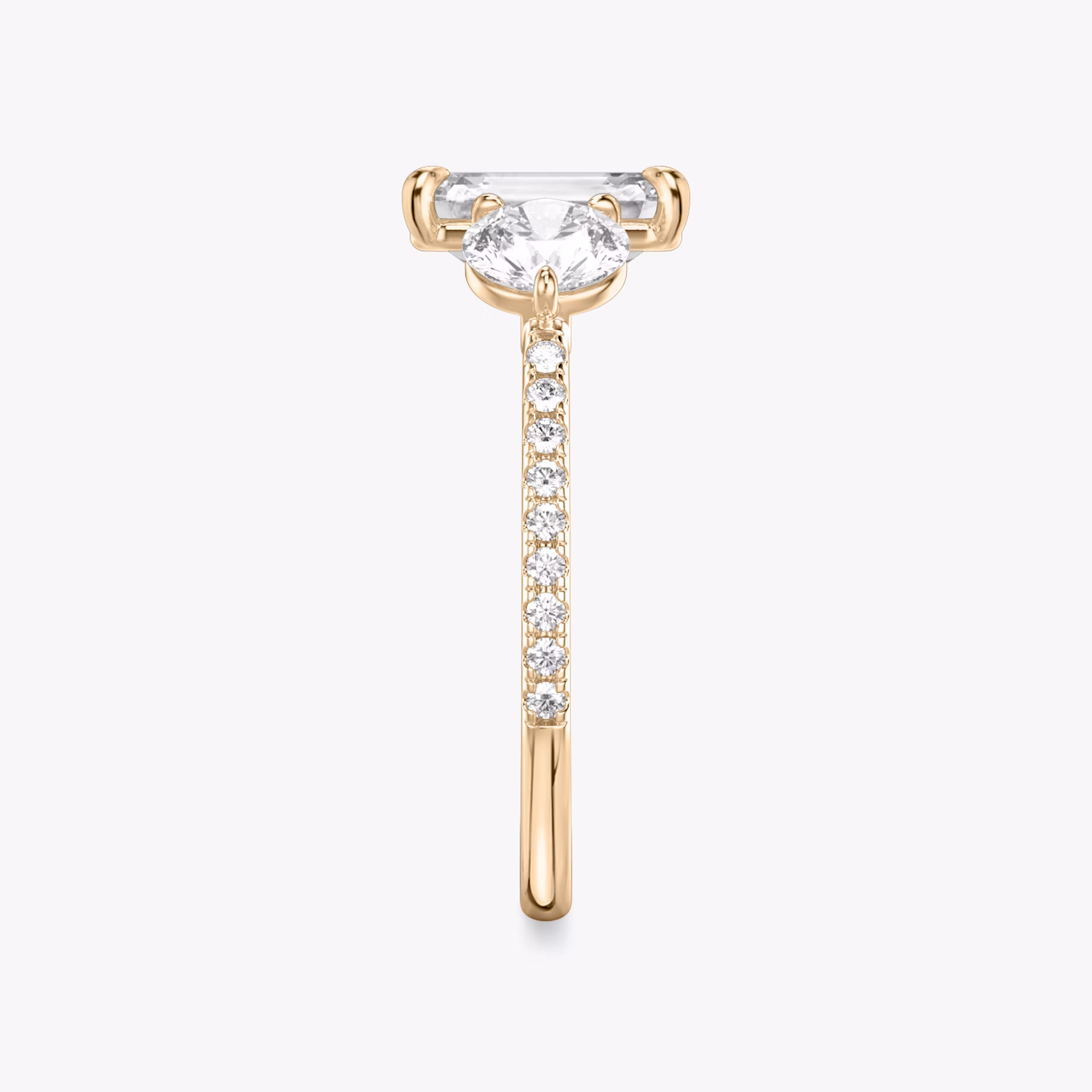 The Three Stone | Emerald | 14k | Rose Gold | bandAccent: Pavé | sideStoneCarat: 0.50ct | sideStoneShape: Round Brilliant | diamondOrientation: vertical | caratWeight: other