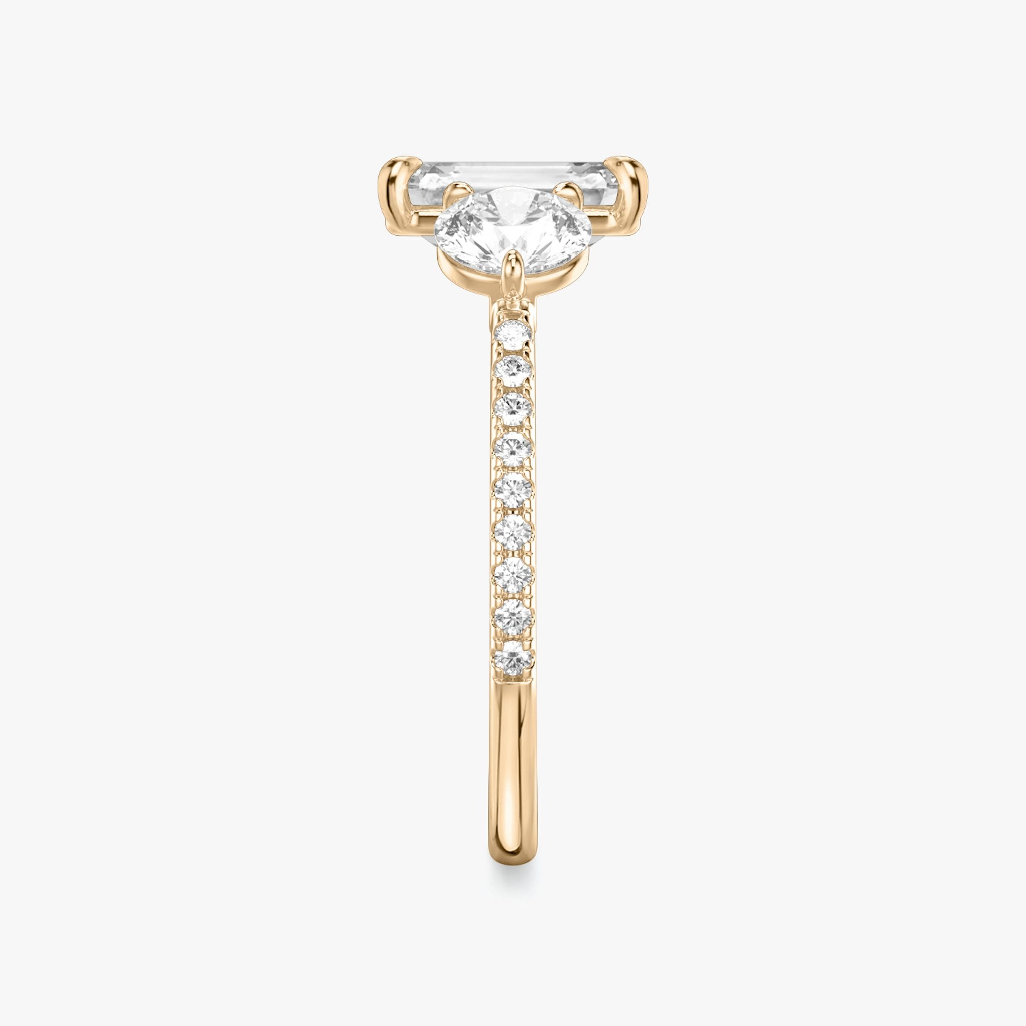 The Three Stone | Emerald | 14k | Rose Gold | bandAccent: Pavé | sideStoneCarat: 0.50ct | sideStoneShape: Round Brilliant | diamondOrientation: vertical | caratWeight: other