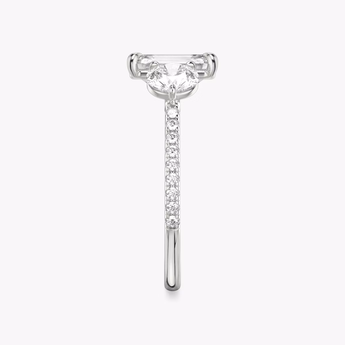 The Three Stone | Emerald | Platinum | bandAccent: Pavé | sideStoneCarat: 0.50ct | sideStoneShape: Round Brilliant | diamondOrientation: vertical | caratWeight: other